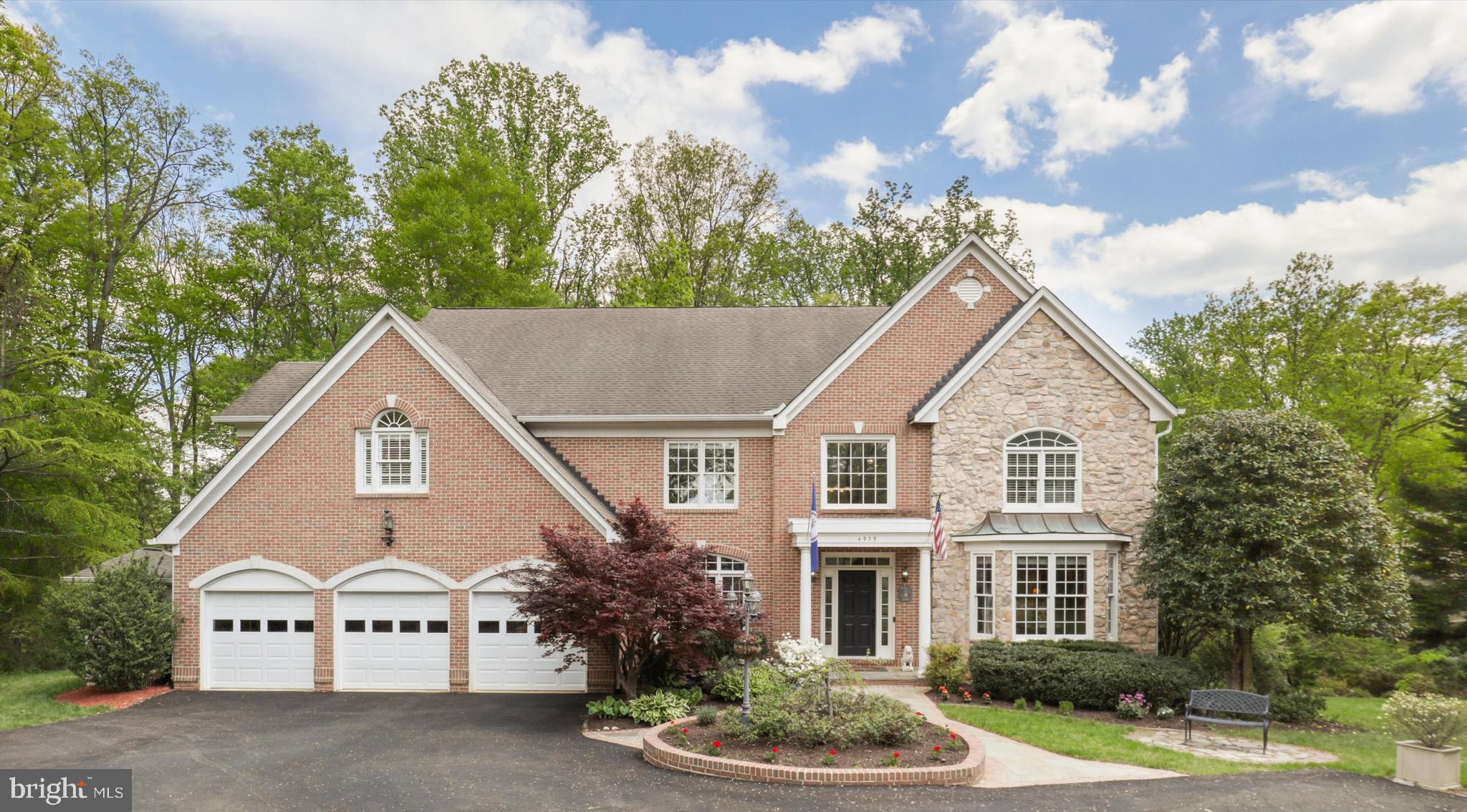 Fall in love with this spacious, custom brick home sited on a private 1.12 acre lot with no HOA.  This executive home is the perfect blend of luxury, comfort and thoughtful design.  The two-story foyer with custom ceiling dome welcomes you with a turned and split staircase into this light-filled home that features wood floors on the main level and upper hallway.  

Boasting 6,600 total sq ft on 3 levels, this 5BR 4.5 bath home is move-in ready with a beautiful, updated kitchen with a custom walnut island with seating and high-end Dekton countertop. The perimeter cabinets feature quartz countertops and a solid quartz backsplash along with a custom Coppersmith hood, floating walnut shelves, induction cooking, 3 ovens and a spacious pantry. The expanded outdoor deck is an entertainers dream with room for dining and lounging while surrounded by green space.

The adjacent family room is ideal for gathering and is highlighted with a 2-story wall of windows and stone fireplace.  The main floor also has a large office with a walk-in closet and could easily be converted to a main level bedroom. 

Retreat to your expansive primary suite on the upper level which features a tray ceiling, sitting area, built in cabinetry, 2 professionally organized closets and a laundry chute.  The gorgeous primary bath features a vaulted ceiling, marble tile, 2 separate vanity cabinets with quartz countertops, lighted mirrors, a jetted tub and walk-in shower with rain shower head. 

The upper level is complemented by a second bedroom which has its own updated en-suite bathroom with shower.  There are 2 additional bedrooms that share an updated third bathroom with a lighted mirror, quartz countertops and chic subway tile tub/shower area.

The lower level is simply stunning and offers almost 1,800 square feet of multi-generational living space.  It offers full size windows and French doors leading to a private stone patio and garden space.  It is an ideal in-law suite as it features a large bedroom and full updated bath with lighted mirror, shower, wet bar/kitchenette, large living room with sitting area and two-sided fireplace, media room with 120” screen and exercise area!

This home offers the perfect combination of wooded area for privacy and lawn area for enjoyment with irrigation on all 4 sides of the home.  Gardening lovers will delight in the raised planters and electrified shed for storage.  The 3 car garage has three new garage doors and new driveway offering ample parking for guests and storage. 

Conveniently located 2 miles to I-495 Beltway, 5.9 miles to the VRE Train Station, 10 miles from the Pentagon and13 miles to the White House.  Multiple private schools are in close proximity: .9 miles to Immanuel K-12 School, 1.8 miles to Thomas Jefferson Science & Technology, 7.9 miles to Bishop O'Connell High School. 1.8 miles to the popular St. James Gym