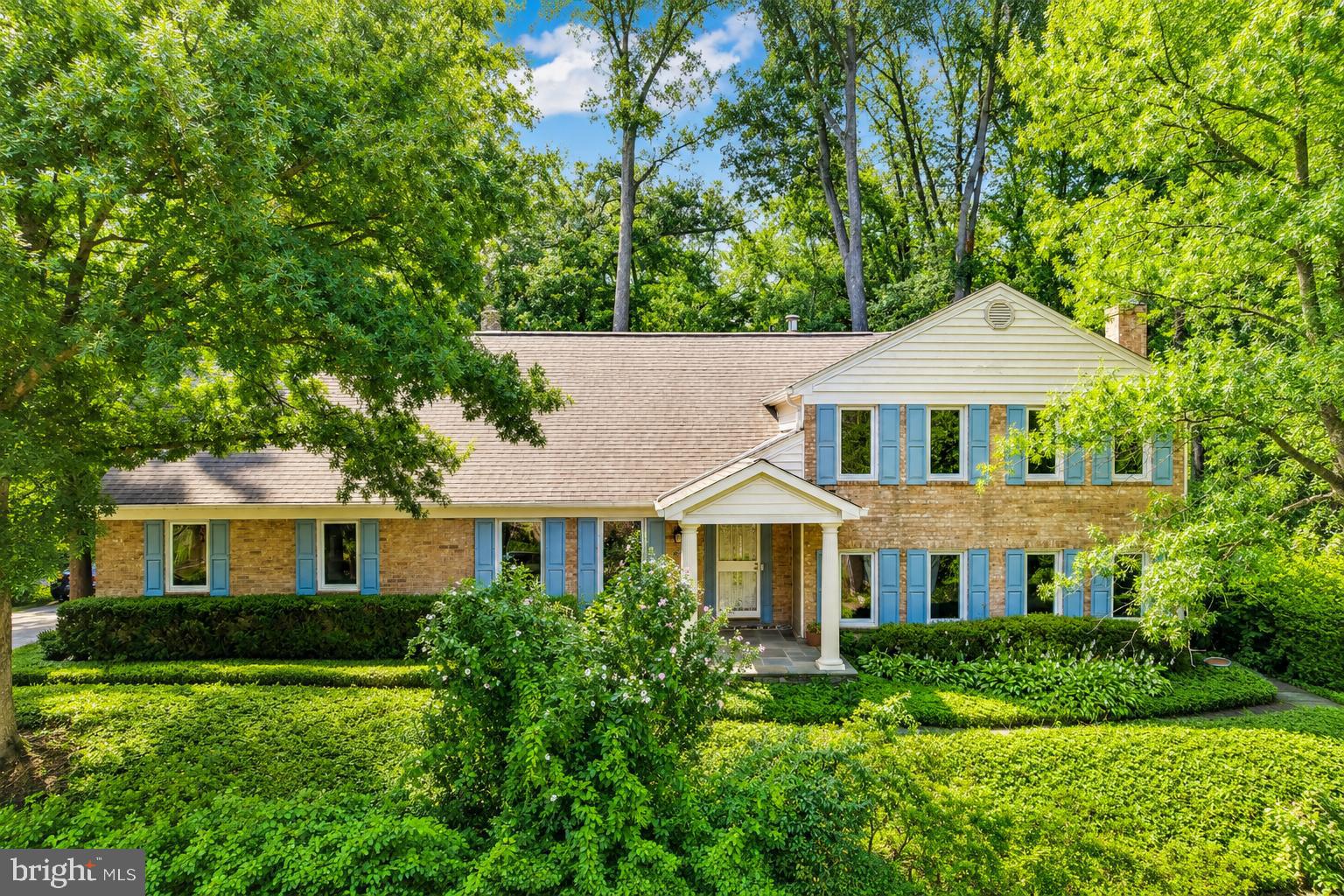 Mature trees, ornamental shrubs, and lush landscaping create a serene park-like setting on a .55-acre lot. This truly unique residence showcases quality craftsmanship, thoughtful design and energy-efficient features amid peaceful outdoor living.  A welcoming foyer with ceramic tile flooring and a Shoji screen coat closet introduces the home's distinctive custom features. Gleaming hardwood floors flow throughout much of the main living areas, while large custom double-pane windows introduce abundant natural light.  The spacious country kitchen features a large center island with a TV nook and seating for up to ten people  Enjoy granite countertops, a tile backsplash, an under-mount sink, stainless steel appliances, custom full-height maple cabinetry, ceramic tile flooring, a ceiling fan, and expansive windows showcasing nature.  The adjoining living and dining rooms are enhanced with crown molding and new Andersen sliding doors that open to the stone patio, creating seamless indoor-outdoor living.  The inviting family room features a remarkable Tulikivi soapstone fireplace installed in 2014. With approximately 87% efficiency, this premium fireplace stores heat within the soapstone and continues to radiate warmth for days while remaining safe to the touch, providing comfort and peace of mind.  The finished game room is ideal for entertaining.  A convenient full bath makes this level suitable for guests or extended living.  The lower level features a spacious recreation room with durable tile flooring, a large storage room, and a separate walk-in storage closet complete with built-in cabinetry, providing exceptional flexibility for hobbies, exercise, or additional living space.  Outdoor living is equally impressive with walkout access to the stone patio enclosed with an aluminum fence, perfect for pets or a secure children's play area.  The mature landscaping creates a private retreat, while the sunny side plot provides charming gardening space.  The oversized attached two-car garage features a new garage door opener, an attached storage room/workshop with extensive built-in shelving, and walkout access to the stone patio.  Upstairs, the spacious primary suite provides a private retreat complete with an adjoining sitting room/lounge space for unwinding.  Three additional bedrooms share a hall BA.  This home has been thoughtfully updated for energy-efficient, year-round comfort, including a high-efficiency variable-speed oil furnace with a steam humidifier, a Trane XL20i heat pump installed in 2012, a light-duty commercial-grade water heater installed in 2024, new custom double-pane energy-efficient windows, new Andersen sliding doors, and the highly efficient Tulikivi soapstone fireplace.  Additional improvements include a roof replaced in 2012 and a LeafFilter® gutter protection system installed in 2020, providing long-term value and low-maintenance living.  Easy commute to Fort Belvoir and the Pentagon.  Located in the sought after Lake Braddock school pyramid, conveniently between two popular shopping centers, You will love it here!