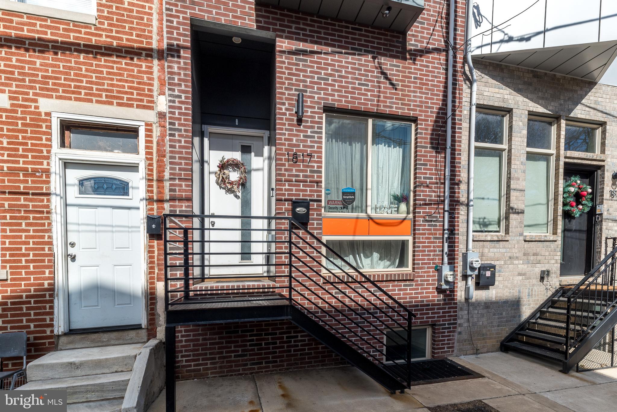 GREAT NEW PRICE!!! Exceptional value!  Welcome to this spectacular 4-bedroom, 4-bath townhome nestled in the vibrant Sharswood neighborhood, right next to buzzing BREWERYTOWN and a 10 minute walk to FAIRMOUNT!!    Don't wait to be part of this EXCITING area with loads of new construction!  Offering sweeping panoramic city views from your private rooftop deck, this contemporary gem is more than just a home - it’s an incredible investment opportunity with FIVE YEARS LEFT ON VALUABLE TAX ABATEMENT.

Step inside and fall in love with the gleaming hardwood floors stretching across all three levels, the abundance of natural light pouring through oversized windows, and the sleek recessed lighting that highlights every stunning detail. The main living space features dramatic 14-foot ceilings and a cozy electric fireplace - perfect for relaxing evenings.

Just a few steps up, you'll find a spacious open-concept dining area and a modern island kitchen outfitted with stainless steel appliances, granite countertops, and sliding doors leading to a deck and fenced-in back patio  - an entertainer’s dream!

The second floor offers two generously sized bedrooms, including one with a private bath and another full hall bath with a walk-in shower. On the third floor, retreat to your expansive primary suite, complete with a spa-like bathroom boasting double vanities and a deluxe oversized shower. You’ll also find a convenient wet bar, laundry area, and a bonus room that’s perfect for a fourth bedroom, office, den, fitness studio, or luxurious dressing room - endless possibilities await!

Take in the sparkling skyline from your rooftop oasis or host unforgettable gatherings in the fully finished basement with another full bathroom and plenty of storage.  Ideal layout for roommates!

All the luxury of new construction - without the wait! Plus, you'll be minutes from FAIRMOUNT, Temple University, trendy coffee shops, popular restaurants, public transportation, I-76, and Center City.  Street parking is always available!

 Quick settlement possible - schedule your private showing today!
