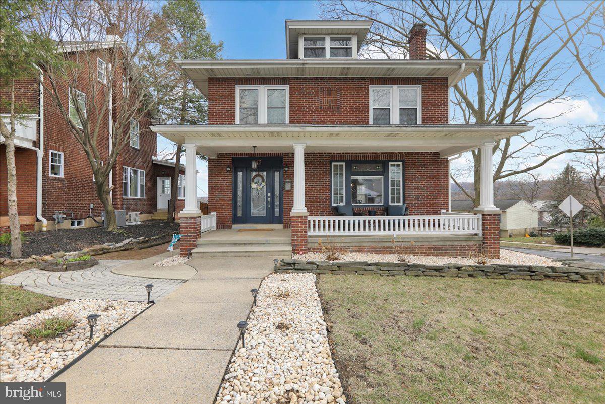 Charming Wilson brick home offers a welcoming front porch, fenced in backyard with patio, and beautiful updates throughout. The living room is flooded with natural light and features built-in cabinetry and hardwood flooring, and the spacious dining room also has hardwood flooring and updated lighting. Next to the dining room is the well appointed kitchen featuring a 5 burner gas range with griddle, microwave, dishwasher, granite countertops, tile backsplash, and stainless steel appliances. Adjacent to the kitchen is the sunroom/breakfast room which provides the perfect place to enjoy your morning cup of coffee. The main level of the home is complemented with a bedroom that includes a full bathroom. This room would be perfect for a home office. The staircase leading to the 2nd floor is adorned by a colorful, stained glass window. Upstairs you will find 3 more bedrooms, including the primary bedroom with an en suite bath, and a 3rd full bathroom. From the 4th bedroom, you can access the attic which has been renovated to a 5th bedroom or bonus space which features engineered hardwood flooring and electric baseboard heating. The rest of the home has natural gas heat and 5 mini splits providing central air. The basement has also been finished to include a rec room with LVT flooring and a bar.