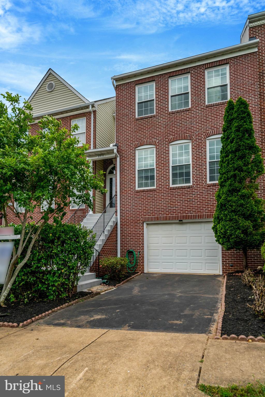 Welcome home to 2916 Mainstone Drive, where timeless charm meets modern updates in one of Fairfax’s most convenient locations. This beautifully refreshed three-level townhome offers nearly 2,800 square feet of living space with 3 spacious bedrooms, 2 full bathrooms, and 2 half bathrooms. Thoughtfully upgraded from top to bottom, the home features fresh paint throughout, luxury vinyl plank flooring in the living room, brand-new flooring in all bathrooms, plush new carpet throughout, updated lighting fixtures in the living room, dining room, kitchen, breakfast area, bathrooms, basement, and multiple closets, plus new ceiling fans in every bedroom. Major recent improvements provide exceptional peace of mind, including a brand-new roof installed in May 2026, along with a new water heater, new windows, and new patio and deck doors installed in 2024.

Inside, you'll find a bright and inviting floor plan designed for comfortable everyday living and effortless entertaining. The spacious living room flows into a formal dining area, while the kitchen and adjoining breakfast area create the perfect hub for gathering with family and friends. Upstairs, the generous primary suite offers a private retreat complete with an en-suite bath and ample closet space, while two additional bedrooms and a second full bathroom provide flexibility for family, guests, or a home office. The finished lower level adds even more living space with a large recreation room, convenient half bath, and endless possibilities for a media room, playroom, gym, or work-from-home setup.

Outdoor living is just as impressive. Step outside to enjoy a spacious private patio—perfect for outdoor dining, entertaining, or simply relaxing—and an elevated deck that expands your living space and provides the ideal setting for morning coffee, evening sunsets, and weekend gatherings. Together, these outdoor spaces create a rare extension of the home's already generous interior.

Ideally located in the heart of Fairfax, you'll enjoy easy access to parks, trails, shopping, dining, and recreation, with the Mosaic District, Metro access, and major commuter routes just minutes away. Move-in-ready homes with this level of updating, space, and location are a rare find. With the major systems already updated and every detail thoughtfully refreshed, all that's left to do is move in and enjoy. Schedule your private tour today and experience everything 2916 Mainstone Drive has to offer before this exceptional opportunity is gone.