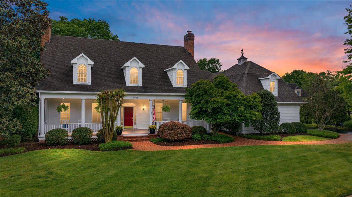 * Join us this Saturday (5/30) from 1–3 PM to tour this beautiful home and experience everything it has to offer in person. From the thoughtful custom design and inviting spaces to the exceptional features throughout, this is an opportunity you will not want to miss.*

Experience true luxury living in this magnificent custom estate nestled within the prestigious gated golf community of Lake Manassas. From the moment you arrive, you are welcomed by lush landscaping and a charming brick walkway leading to the expansive covered front porch. Accented with cedar board ceilings, this picturesque outdoor space serves as a seamless extension of the home which is perfect for morning coffee, evening cocktails, and year-round enjoyment. Meticulous craftsmanship and exceptional design blend effortlessly to create a home that is elegant, modern, and inviting. Inside, the grand two-story foyer opens to gleaming hardwood floors, custom built-ins, pocket doors, archways, and crown molding throughout. The thoughtfully designed floor plan offers spacious, sun-filled living areas including formal living and dining rooms, a powder room, and two wood-burning fireplaces. The gourmet chef’s kitchen is beautifully appointed with a Sub-Zero refrigerator, 6-burner Thermador gas range, and dishwasher, complemented by quartz countertops, premium cabinetry, a large center island, butler’s pantry, and walk-in food pantry. Four sets of custom French doors and multiple skylights bright plenty of natural light into the home while showcasing serene backyard views. Outdoor entertaining is effortless with the expansive deck and built-in stone cooking area. The main-level owner’s suite is a true retreat featuring private outdoor access, vaulted ceilings, and an oversized walk-in closet. The spa-inspired primary bath offers a freestanding soaking tub, dual vanities, rainfall shower, and heated floors. Upstairs, four generously sized guest bedrooms are served by three recently renovated full baths. An additional flexible living space is ideal for a recreation room, playroom, media room, or home office.
The fully finished lower level is truly a showstopper, featuring a full wet bar, impressive 650-bottle wine cellar, high-end billiards room, two full baths and one half bath with steam showers, plus a private in-law suite complete with separate entrance/walk-out access, kitchenette, additional laundry room, and spacious living room with gas fireplace. Meticulously maintained, this exceptional residence boasts over $250,000 in upgrades and renovations throughout. Lake Manassas is home to the prestigious Robert Trent Jones Golf Club, host of the 2024 Solheim Cup, as well as the award-winning Stonewall Golf Club. Ideally situated on a premium corner lot just minutes from I-66, Route 28, shopping, dining, and commuter lots, this extraordinary property offers luxury living at its finest. This is a rare opportunity you will not want to miss. Come experience the lifestyle you deserve! Schedule your showing appointment today!