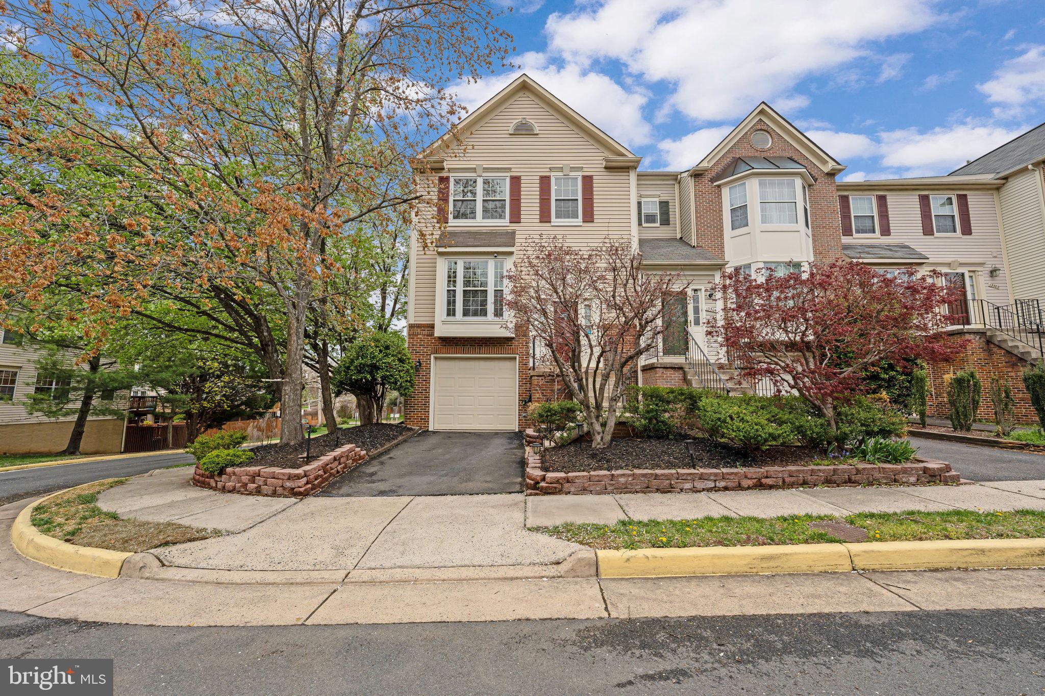 This beautiful and updated Clifton end-unit townhouse could be your new home! Fantastic features include a beautiful deck, a backyard hot tub, gleaming hardwood floors on the main level, LVP flooring on the lower level, 3 bedrooms also with LVP flooring, 2 full baths and 2 half baths, a wood-burning fireplace, and plenty of windows bringing in abundant natural light. Exterior hardscaping adds great curb appeal! Walking through the front door, you can immediately see how well-maintained and cared-for this house is. Walk past one of the half baths conveniently located in the foyer to discover the lovely kitchen featuring brand-new stainless-steel GE appliances, granite countertops, and plenty of cabinet storage. It also looks out over the bright and open dining space and family room complete with an accent wall and a door out to the deck. A welcoming space to enjoy a meal and to gather with friends and family! Head down to the lower level to discover an updated LG washer and dryer, the second half bath, and the fireplace lending the room a cozy atmosphere. From the lower level, you will find a door out to the fully-decked and the hot tub. A fence around the deck ensures privacy making this a great place to enjoy time outside! On the upper level, the bedrooms and full baths offer space for family and guests alike. The large primary bedroom is a great space to relax at the end of a long day! The home also has a garage with a second fridge that conveys and a driveway with a parking space. Nearby guest parking makes it easy for visitors to stop by! All this and a great location close to downtown Clifton as well as parks, golf courses, stores, restaurants, and only 15 min to Dulles Airport! Don’t wait on this amazing property! Schedule a tour today! New stainless steel GE microwave, refrigerator, dishwasher, and stove (2025); LED recessed ceiling lights; new switch plates; new crystal ceiling lights in kitchen and living room (2024); deck refinished (2022); new LG washer and dryer (2021); basement flooring replaced with LVP; main level and staircase flooring replaced with hardwood; updated bathroom mirrors, faucets, and lighting; fresh paint throughout; new hot tub cover and pump; custom closet installed in basement (2020); new outdoor lighting (2019); new fridge in garage (2018)