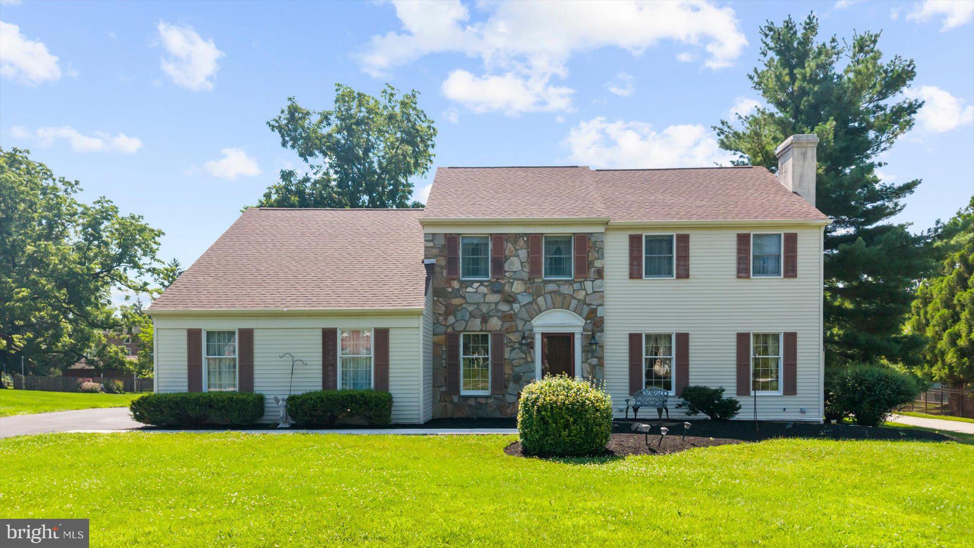 Nestled in a serene setting on a flat lot, this charming Colonial home offers a perfect blend of comfort and community.  This freshly painted residence features four spacious bedrooms and two and a half bathrooms with hardwood and LVT flooring throughout the main level and all new carpeting on the 2nd floor.  The heart of the home boasts two inviting fireplaces, perfect for cozy evenings spent with loved ones. The full basement and full walk up attic provides ample storage or the potential for additional living space, while the main floor laundry adds convenience to your daily routine. The attached side-entry garage ensures easy access and plenty of parking for guests. Situated on a generous 0.53-acre lot, the outdoor space invites you to enjoy the beauty of nature right at your doorstep. Imagine summer barbecues and peaceful evenings on your deck, surrounded by the tranquility of your private yard.  Residents enjoy easy access to local parks, perfect for weekend picnics and outdoor activities.  Room sizes are provided as a courtesy but should not be relied upon by any buyers or agents. The buyer must verify the room sizes themselves.