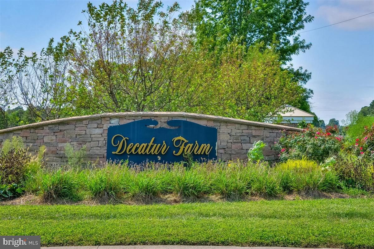 Welcome to this beautifully maintained 3-bedroom, 2.5-bath townhome in the sought-after Decatur Farms community, just minutes from charming downtown Berlin. Step inside to find durable tile flooring throughout the first level and a spacious, open-concept layout designed for comfortable everyday living. The updated kitchen features granite countertops, stainless steel appliances, and a sliding glass door leading to a private, fenced backyard that backs to peaceful woods, perfect for relaxing, entertaining, or letting pets play.
The adjoining dining and family room is filled with natural light from three large windows, creating a warm and inviting gathering space. A convenient powder room and interior access to the one-car garage complete the first floor. Upstairs, the spacious primary suite offers a walk-in closet, new window shades, and an en-suite bath with tile flooring and double vanities. Two additional bedrooms, including one with a walk-in closet, share a hall bath featuring a tiled shower. The second-floor laundry room includes a full-size washer and dryer for added convenience. Residents of Decatur Farms enjoy outstanding community amenities, including exterior building and common area maintenance, a clubhouse, outdoor pool fitness center, and playground. This move-in ready home offers low-maintenance living in an ideal location close to shopping, dining, schools, and everything Berlin has to offer.