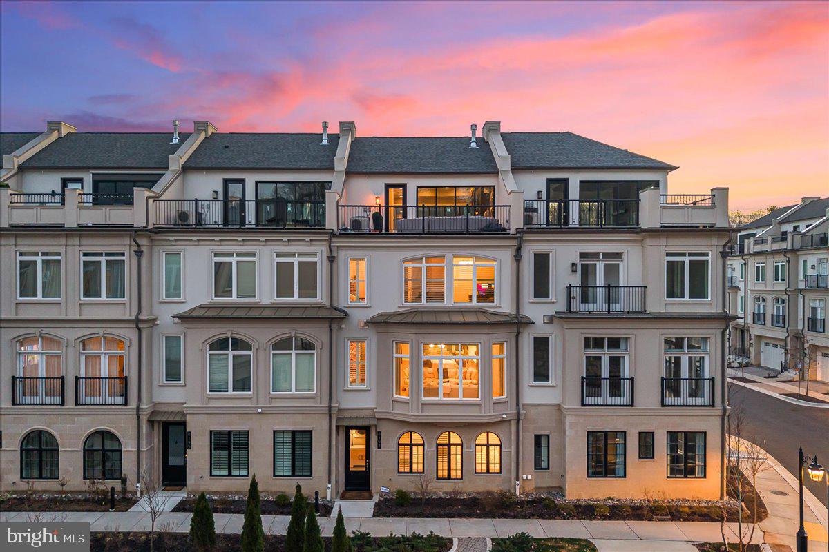 Welcome to this sublime 4-level, 3350SF townhome with an elevator, located in the amenity-rich Quarry Springs community.  A quiet location on an interior street (not facing River Rd), this model includes a rare 4th bedroom with a full bath on the entry level, a separate dog room (or extra storage space) with its own rear entrance, an elevator serving all four floors, and access to the 2-car garage. The main level showcases an open floor plan perfect for entertaining, with a sleek gourmet kitchen featuring a large island, floor-to-ceiling cabinets and three pantries, a spacious dining area, an inviting living room with a gas fireplace, and a powder room.  Upstairs, you'll find an impressive owner's suite with a walk-in closet with built-ins, a spa bath with an oversized shower, an expansive vanity with two sinks, and a water closet, as well as two more ample bedrooms, a large laundry room, and a full hall bath.  The top floor offers a striking family room with a built-in bar area, a dramatic fireplace wall, sliding glass walls to the front and rear roof decks for sunsets and outdoor gatherings, and a rare second powder room.  A "green" extra- an EV charger in the garage will convey!

Quarry Springs offers a guarded gatehouse, an elegant clubhouse with a catering kitchen and bar, a well-equipped gym, party rooms, and a beautiful outdoor pool.  Outside, enjoy the dog park, walking trails, and a stunning waterfall and stream along the quarry wall.  Please contact the listing agents to schedule a private appointment to see this in-model-condition and ready-to-move-in beauty.

Note: county tax record SF is incorrect- did not include the top floor.  Appraisal SF finished is 3350SF, not including the garage. 

(After entering through the guarded gatehouse, turn left and follow the road to 8197, a quiet spot with plenty of guest parking)