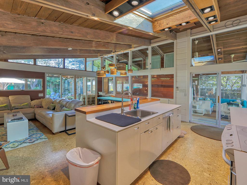 Ocean Block CALIFORNIA STYLE 4BR, 4BA  BEACH HOUSE.   Year Round light filled open floor plan home, inside & outside porches, pool & fire pit, outside shower, offered FURNISHED.   STEPS TO RELAXING GOOD TIMES AT THE BEACH.  Cool 1960's beach vibe is super fun, airy & renovated completely - the latest appliances, finishes & functional spaces.   Dewey Beach is dog friendly, offers great food & drinks, evening bonfires & music.   Not in a flood zone.  Potential rental income of over $150,000 per year (Summer will rent for over $12,000 per week.   Offered for $2,990,000 FEE SIMPLE, ie you own the land (0wner will hold a 10 year mortgage)....or  Offered for $1,995,000 with a $29,000 per year land lease.