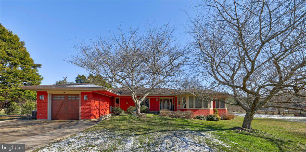 Welcome Home! Don't miss your opportunity to own in the sought-after waterfront community of Stray Fox off of Assateague Rd.  Nestled on over an acre, this custom built home home offers the simplicity of 1-level living in a serene and quiet setting.   Enjoy your coffee on the expansive deck overlooking your backyard or from your three-season porch. Inside you will find plenty of living space including living room with double-sided gas fireplace, spacious dining room,  eat-in kitchen with additional sitting area.  This home was designed with many accessibility features in-mind making it easy to get around.  Freshly painted, this home has been  lovingly maintained with quality updates over the years. Newer HVAC and emergency back-up generator offer peace-of-mind.  Conveniently located between Ocean City and Downtown Berlin, you are just minutes from the  Beaches, some of the best restaurants, schools, golf courses and marinas this area offers! Hurry! This one won't last long!