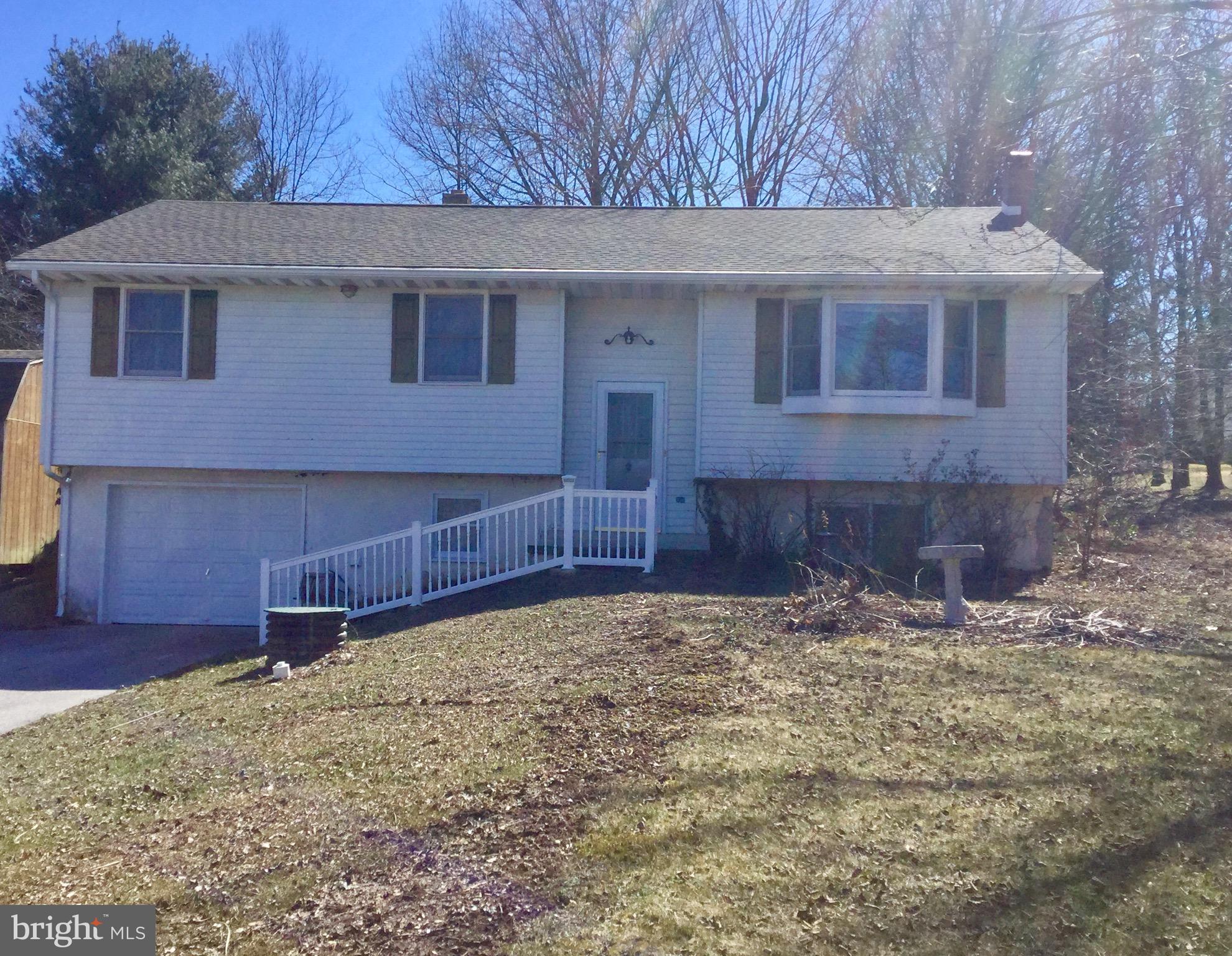 Welcome home to country living on 1.22 acres. Only 2 minutes to Codorus- bring your boat, kayaks and fishing poles!  Three nice sized bedrooms, large full bath, kitchen/dining area and living area with nice bay/bow window overlooking the humongous front yard.  Walk out from the dining area to the wonderful covered back deck and take in the wooded scenery.  Relax in the lower level family room with wood stove, laundry and bath with stand up shower, storage/utility room and garage entrance.  This lot will be hard to beat.  If you're looking for a nice country lot, don't miss this one!