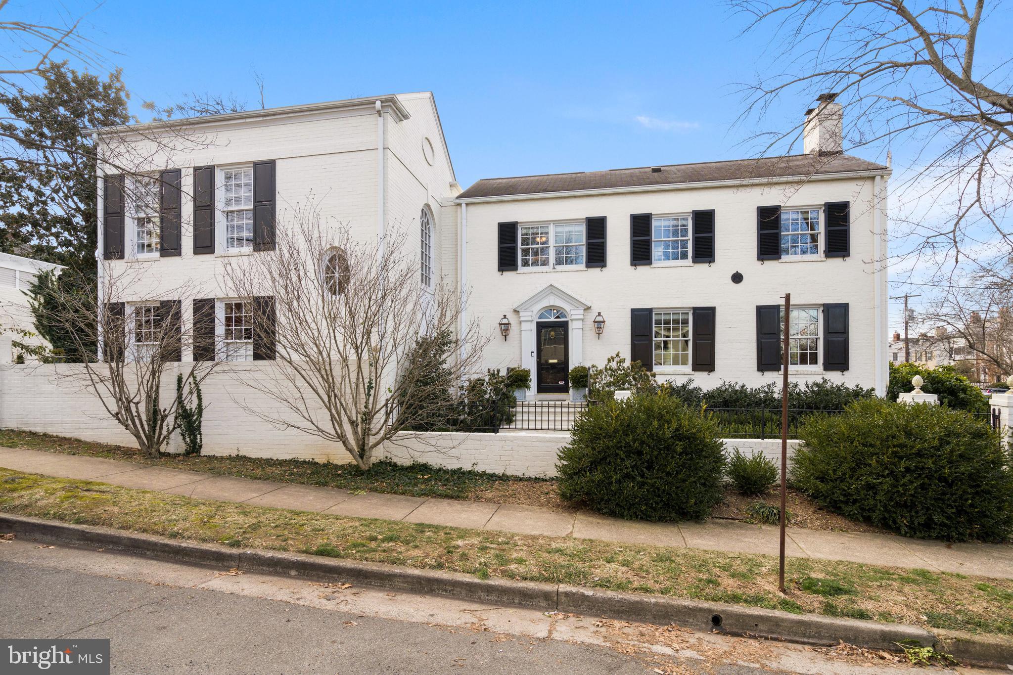 Elegant and sophisticated end brick townhouse on the corner of South Royal Street and Jefferson Street extending half a block up Jefferson Street. Gorgeous walled gardens with slate patio and walkways, styled after an English country garden in the heart of Old Town!  Formal entry hall opens to grand dining room, formal living room with gas fireplace and on to the family room and eat in gourmet kitchen. The family room French doors open to the private walled garden for delightful three season entertaining!
The upper level offers a fabulous primary bedroom suite with en suite bath, air jetted soaking tub and separate shower. There are three additional bedrooms on this upper level and a hall bath. One bedroom has been set up as an office and another as an upstairs study.  The lower level offers a spacious rec room, a huge fifth bedroom or exercise room as well as a full bath and not one but two storage rooms. 
The corner location of this house on both Royal and Jefferson Streets offers ample street parking for owners and guests! Walk to Balducci's and Safeway, parks and the River and all the shops in the heart of Old Town!