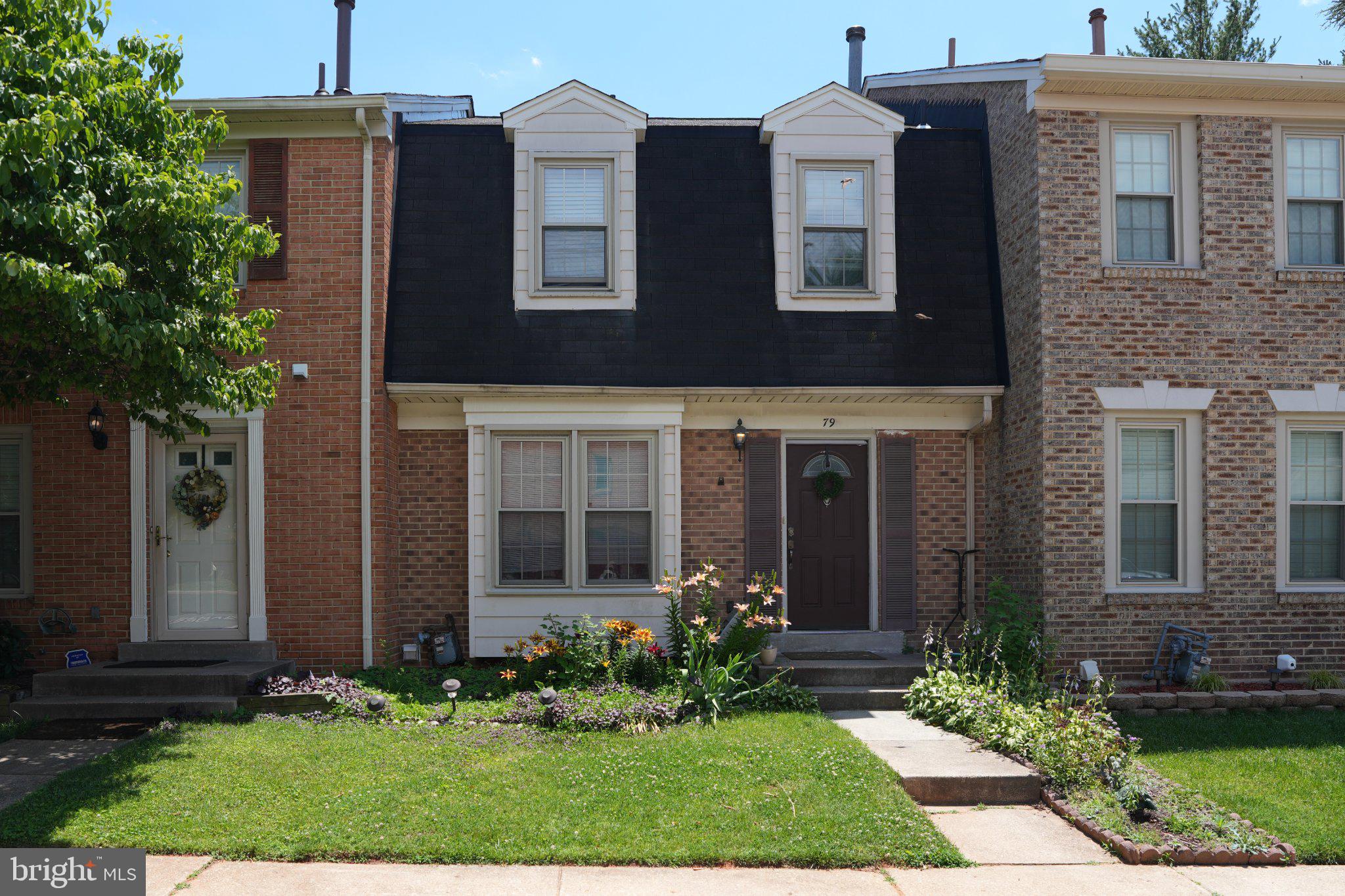 You will love the feel of this bright and spacious brick-front 3-level, 3-bedroom, 2.5-bath townhome nestled in the wonderful Brighton East community! Move-in ready with recent updates including a new water heater (2026), new dishwasher (2026), and new basement carpet (2025), this home features gleaming hardwood floors throughout the main level and an open living and dining area filled with natural light from beautiful windows, creating a warm and inviting atmosphere.

The updated kitchen offers granite countertops, ceramic tile flooring, stainless steel appliances, and additional table space for casual dining.

Upstairs, you'll find three generously sized bedrooms and two full bathrooms, providing comfortable living space for family and guests.

The finished walk-out lower level features a spacious recreation/family room with a cozy wood-burning fireplace and plenty of room for entertaining, watching TV, exercising, playing games, or simply relaxing. A large utility room provides abundant storage for seasonal and everyday items.

Step outside to a fully fenced backyard with a large brick patio, perfect for outdoor entertaining, gardening, or simply enjoying the outdoors.

The home includes two assigned parking spaces plus ample visitor parking.

Enjoy all that Brighton East has to offer with community amenities including a swimming pool, tennis courts, tot lots, parks, and walking and biking trails. Conveniently located just minutes from I-270, public transportation, the public library, shopping, banking, restaurants, and much more.

Hurry—this beautiful home won't last long!