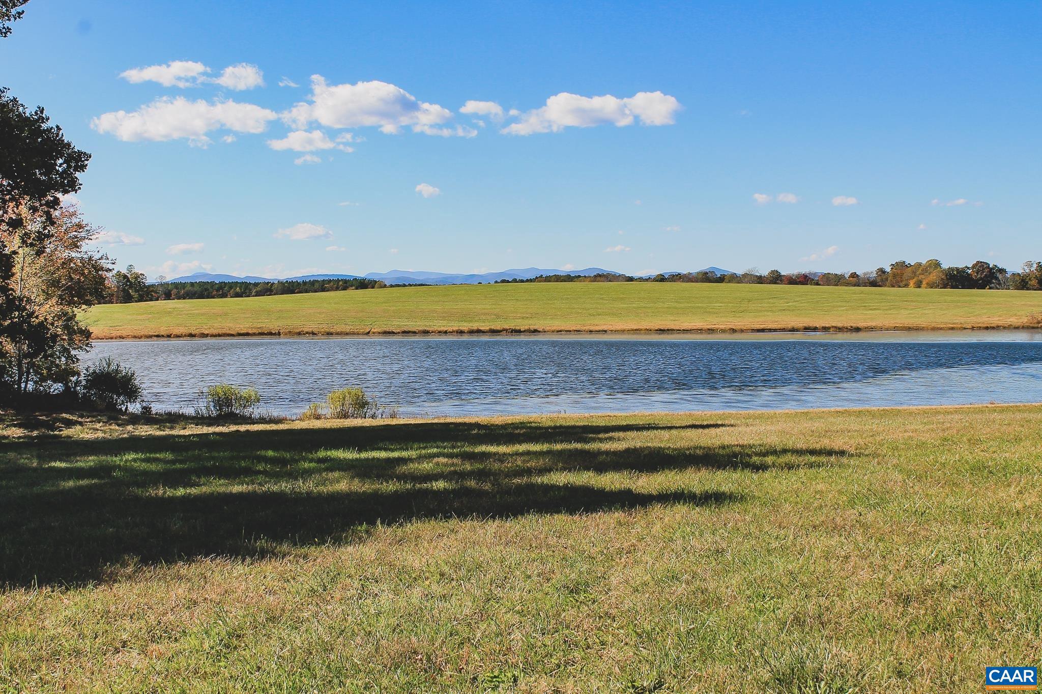 Incredible mountain view lot on over 17 acres just outside of Charlottesville, Virginia. This lot has gently rolling terrain, multiple build sites with expansive mountain views, and frontage along a large, 4.5 acre pond. The build site's breathtaking view looks across the water with the mountains in the distance. This lot has been perked for a conventional, 6 bedroom drain field with a recent survey recorded, and has plenty of road frontage along Rolling Rd and Briery Creek. Start your dream home build on acreage overlooking the water and mountains. Underground electricity available with CVEC, and high speed fiber optic internet available through Firefly.   This is Lot #17 within Oakwater Estates, a new development with high acreage lots in both Fluvanna and Albemarle County. There is no HOA, and bringing your own builder is welcome and expected. Covenants and Restrictions apply. Horses welcome, detached guest cottages and barns welcome.   Minutes from renown wineries and approximately 25 minutes from downtown Charlottesville.   The Timbers Group has direct ownership interest in Oakwater Estates. This ownership disclosure is made and pursuant to Virginia Law section 54.1-2138.2.,17 Acre Mountain View and Pond Lot