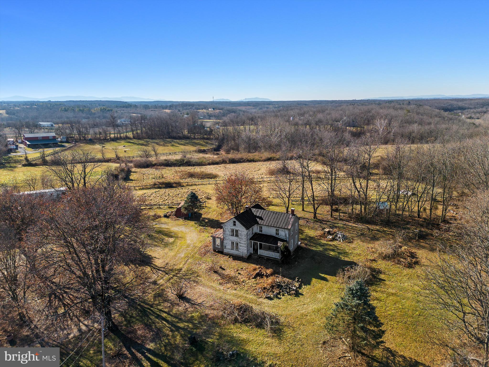 Property like this doesn't often come for sale in Clarke!  Nearly 30 private acres, split between scenic pasture and Opequon creek frontage.   The location and water frontage can't be duplicated.  Home and outbuildings need renovations.  Great horse property with multiple paddocks and pastures.  Two Ponds.  HUGE barn includes stalls and tack-rooms., with multiple options for animals.  The classic farmhouse is in need of TLC, but electrical and plumbing have been upgraded in key areas. Large rooms.  In the spirit of conservation, property is held in easement and cannot be subdivided.  Most government loans and most conventional loans won't apply due to rehab.  Appointment is necessary for viewing.  Walking the property is prohibited without an appointment.