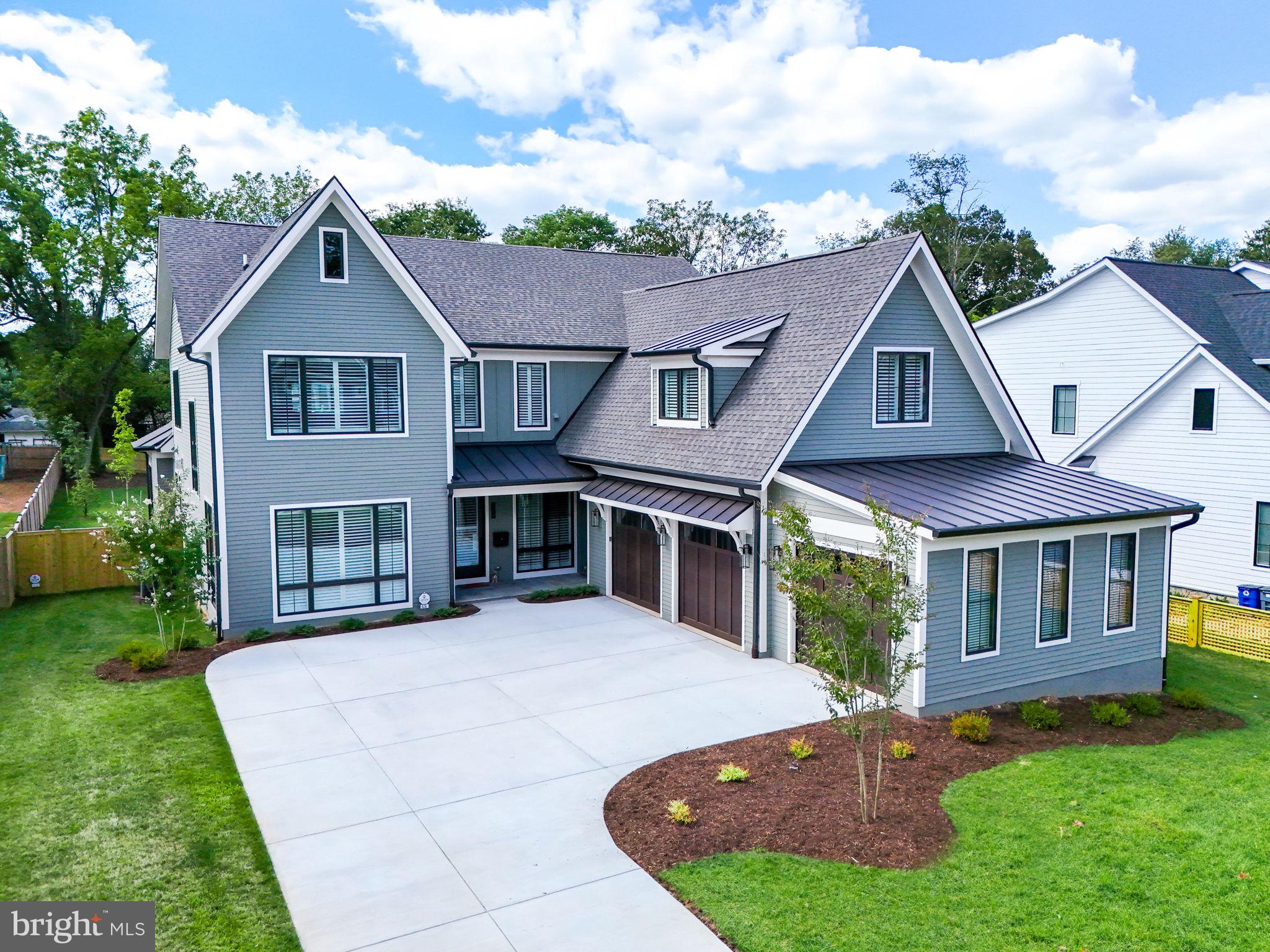 NEW CONSTRUCTION.  PRICE REDUCED.  Don’t Miss This Amazing Home!! It is The Crown Jewel of Vienna!! Luxury, quality home with over 6,500 finished square feet above grade.  Over 9,000 total finished square footage. Built in 2023 by reputable local builder. Many lovely architectural features set this home apart from other new homes in the area:  several rooms have shiplap  accent walls,  warm wood beams and matching mantle in the living room also add to the stylish and unique aesthetics of the home.  The 7" white oak engineered wood flooring are not just on the main level but on the upper 2 levels also.  Interior designer helped to craft concepts for exceptional features and quality throughout.  This premium property includes an elevator, whole house generator, and sprinkler system.  3-car side loading garage. Prime Town of Vienna location, on a level, fenced half-acre lot.  Spectacular main level  primary suite with vaulted ceiling, elegant adjoining bathroom and walk in closet.  Open floor plan on main level includes an exquisite gourmet kitchen with 6 burner Wolf range, 48-inch Sub Zero fridge, Cove dishwasher.  10 foot Quartz island.  This open floor plan space also includes a spacious family room with gas fireplace, dining room and eat-in kitchen space. Direct access from garage and front porch to mudroom with cubbies, drawers, custom tile, and separate half bath. Main Level Study/Office full of natural light. Custom ceiling moldings throughout main level.  Oversize glass doors from family room to covered porch area. Screened in porch with gas fireplace off kitchen provides a peaceful setting and overlooks the back yard.  Beautiful 7" Engineered Wood flooring.  4 ensuite bedrooms on upper level 1, including an incredible primary bedroom with a sitting room/study/bonus room, walk in closet and bathroom with soaking tub, separate shower, plus heated floors.  Upper level 2 has a loft/living area, and another ensuite bedroom. 
Lower Level consists of a  bedroom with private bath, and a large exercise room/media room. Wet bar with island, dishwasher and beverage refrigerator.  Powder room, and huge recreation room with built in cabinets and gas fireplace. Elevator installed July 2023.   Whole house generator installed end October 2023.   10ft Ceilings and 8ft doors.  
Tank-less hot water heater and high-efficiency HVAC.  Full in-ground irrigation. Hardiplank siding from the new magnolia line.  Pella  windows. Beautiful quality custom wood blinds and roller blinds throughout.  
Close proximity to Tysons, Mosaic, major highways, Vienna metro station, and walking distance to town. Easy commute to either Reagan National or Dulles International Airports.  Vienna Elementary, Thoreau Middle, and Madison High School.  Builders Warranty through June 2024.  Tradesman warranty valid through June 2025. Structural warranty- 10 years.  through June 2033. Can show anytime with 2 hours notice.