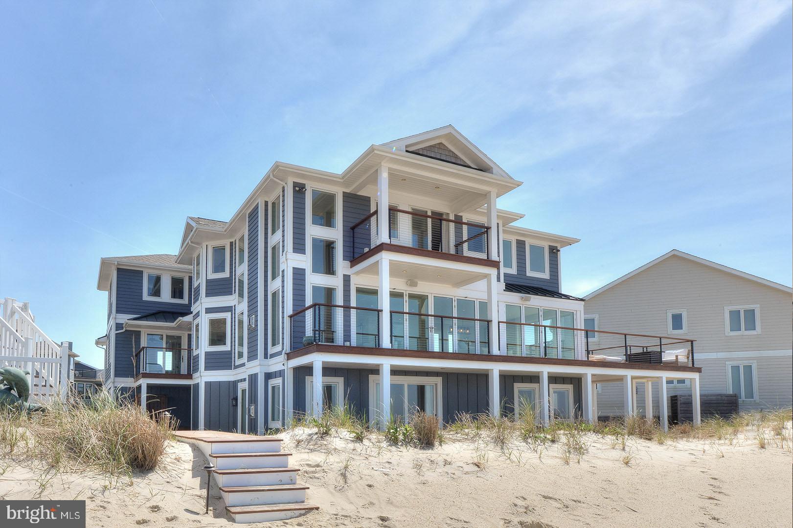 Rarely available Lewes bayfront opportunity in the exclusive and amenity rich community of Cape Shores. Beach access, pool access, tennis, pickleball, fishing, kayaking and more are at your immediate disposal in this sought-after Lewes community. Neighboring Cape Henlopen State Park, you will find miles of hiking, running and bike trails, camping, a nature center, historic landmarks, and ocean beaches. This location leaves little to be desired. While originally built in 1999, this stunning residence was completely renovated in 2018 by the current owners at which time absolutely no detail was overlooked. Coastal chic describes this exquisite home featuring 6 bedrooms, 5.5 baths, +/- 6,000 sf, where every room was carefully designed to take in unparalleled views of the Delaware Bay. Cool earth tones and soft, neutral toned fabrics are used throughout the home as to draw your attention to the stunning water views that can be enjoyed from each of the home’s three levels. The main level (2nd) is breathtaking and features a wall of floor to ceiling windows that lead to the open water views. This NanaWall system can be completely opened to bring the outside in for fresh air and sunlight, which takes full advantage of the picturesque setting. The wide-open space on this floor allows for panoramic views from any angle and is connected with beautiful 7” white oak flooring throughout. The gourmet kitchen is stunning and complete with commercial grade appliances by Wolfe and SubZero, an oversized quartz island, walk-in pantry, multiple wine refrigeration units, beautiful tile backsplash and more. The bayfront family room includes a cozy fireplace and is adjacent to the dining area, which all leads seamlessly to the open sundeck. In addition, this level features a laundry area (hook-up), guest suite with private sitting area, and powder room. The first level features an entrance foyer where you will be greeted with a gorgeous white oak floating staircase with custom stainless-steel railings. Also, this level includes a spacious den complete with a wet bar, custom built-in cabinetry, gas fireplace, two guest bedrooms, full bath, and an oversized custom finished 2-car garage with ample storage. The beautiful white oak flooring continues to the third level where you will find a stunning bayfront primary master suite complete with a spacious walk-in closet and a spa-like bath with soaking tub. In addition, this floor features a laundry closet, two guest suites and flex space perfect for a media room, fitness room, home office, or 7th bedroom. Additional features include multiple decks and balconies, elevator, outdoor shower, private beach walk, beautiful landscaping and more. This home leaves very little to the imagination and is truly a must-see property.