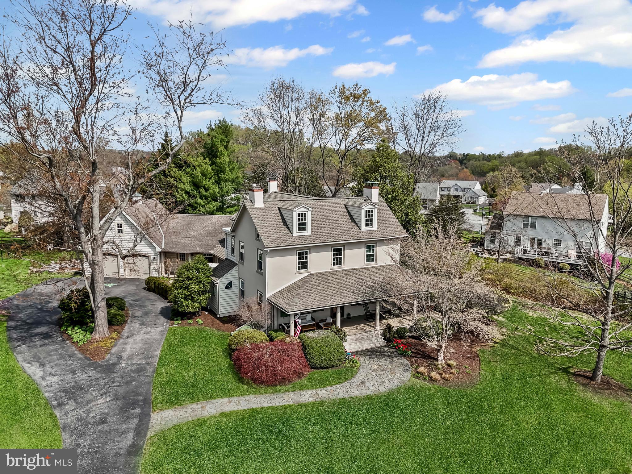 A rare opportunity to have the best of two worlds! Welcome to 148 Bromley Dr, known as the J. McCormick Farmhouse. Live in a historic 1800’s farmhouse that has been renovated through the years to meet today’s standards while enjoying the benefits of neighborhood living in the established community of Breckenridge. Situated in the rear of the community, on a lovely 2/3 acre lot  and at the end of the cul-de-sac. The original structure was built around 1810 by the Pierce family then sold about 10 years later to John Mitchell. Mr. Mitchell was one of the first property “flippers”. He is known for purchasing homes in the Mill Creek area, improving them, then selling for a profit or leasing to tenants. In this case, the property was kept in the Mitchell family for over 120 years. The farmhouse was saved from demolishment and restored in the early 1990’s. Preservation of the original features of the home was paramount and you can still find the molded mantels of three fireplaces, splayed and paneled window reveals, numerous built-ins, and molded four panel doors. Curb appeal can’t be beat with a wide and sprawling front porch welcoming you into the stuccoed, masonry two story home. Additions to the home in 1830 (back wing) and 2000 (rear porch, garage and shop) enhanced the livability of the home as time passed. The main floor is host to a comfortable living room with adjacent parlor or family room, large dining room perfect for everyday use or formal occasions, a well equipped eat-in kitchen, mudroom and powder room. Upstairs you will find a primary owners suite with fireplace, built-in window seats, walk-in closet, and full bathroom with oversized shower featured two rain heads. Second floor is complete with two additional bedrooms and full hall bath with jetted tub. Finished attic space is flexible space that works well as a bedroom, office or craft room. Huge storage area for closet space or seasonal needs. Workshop adjacent to the two car garage with electric, heat/air and water. Above the garage is unfinished loft space that can be easily finished for additional living area. The property features beautiful gardens that give color and interest all season long with an emphasis on native plants. Also installed in 2024, you'll find raised bed gardens with drip irrigation.  Imagine a perfect ending to a summer’s day of sitting on your front porch swing watching the fireflies dance in the gardens while winding down after at day at nearby Westminster community pool. Additional improvements include new roof, carpet and garage doors (2020), repainted exterior (2025), all new windows throughout (2023),built in bookcases (2022),new water heater (2019), west facing roof new in 2014, 2 air conditioning units installed (2011), new mini split in the workshop (2024), and updates to kitchen including new refrigerator (2022),microwave (2020), dishwasher (2015),oven (2015) as well as new washer/dryer (2022).