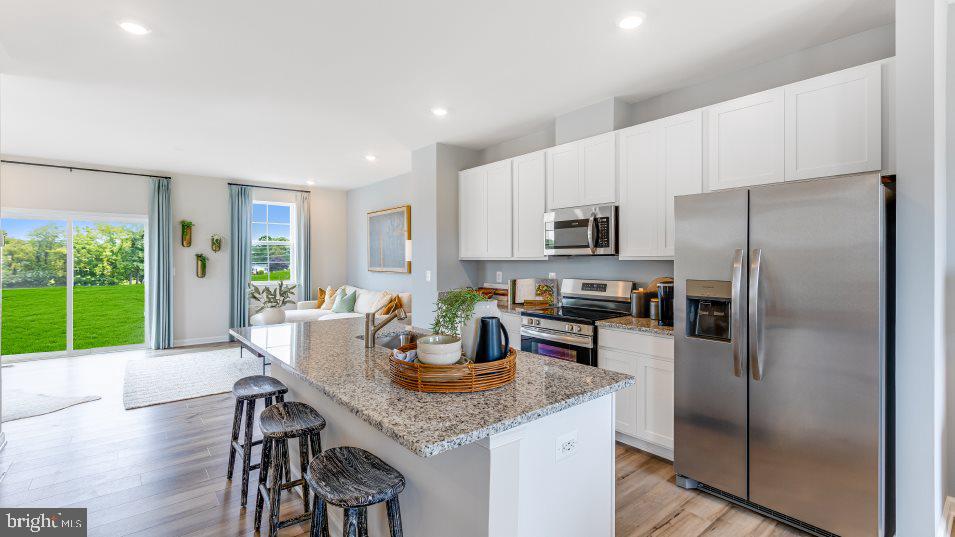 Be the first to call this brand new, never-lived-in home yours! Perfectly located in the charming town of Inwood, this home offers convenience at its best—just minutes from shopping, dining, and entertainment, with easy access to Martinsburg, Charles Town, Harpers Ferry, Shepherdstown, Winchester, Northern Virginia, and Hagerstown.
Step inside to a sun-filled open floor plan featuring LVP flooring, recessed lighting, and a modern kitchen with an island breakfast bar, ample cabinet and counter space, granite counters, and stainless steel appliances. The kitchen flows seamlessly into the dining area and family room—ideal for gatherings and everyday living.
The lower level boasts a spacious rec room, while the upper level offers a generous primary suite with a walk-in closet and spa-like bath featuring double sinks. Laundry is conveniently located upstairs. A 1-car garage plus 2 driveway spaces provide plenty of parking.
Enjoy peace of mind renting a new construction home still under builder warranties—move in and leave your worries at the door! ***Photos are of the community model home. Home will not be furnished. Home will not have a deck.
