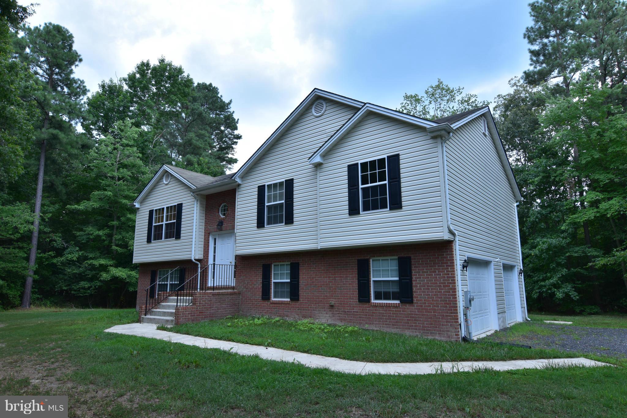 Lovely split foyer with open floor plan.  Kitchen with breakfast bar.  Dining room with sliders to deck.  Unfinished basement.  Oversized 2 car garage.  Pets case by case.