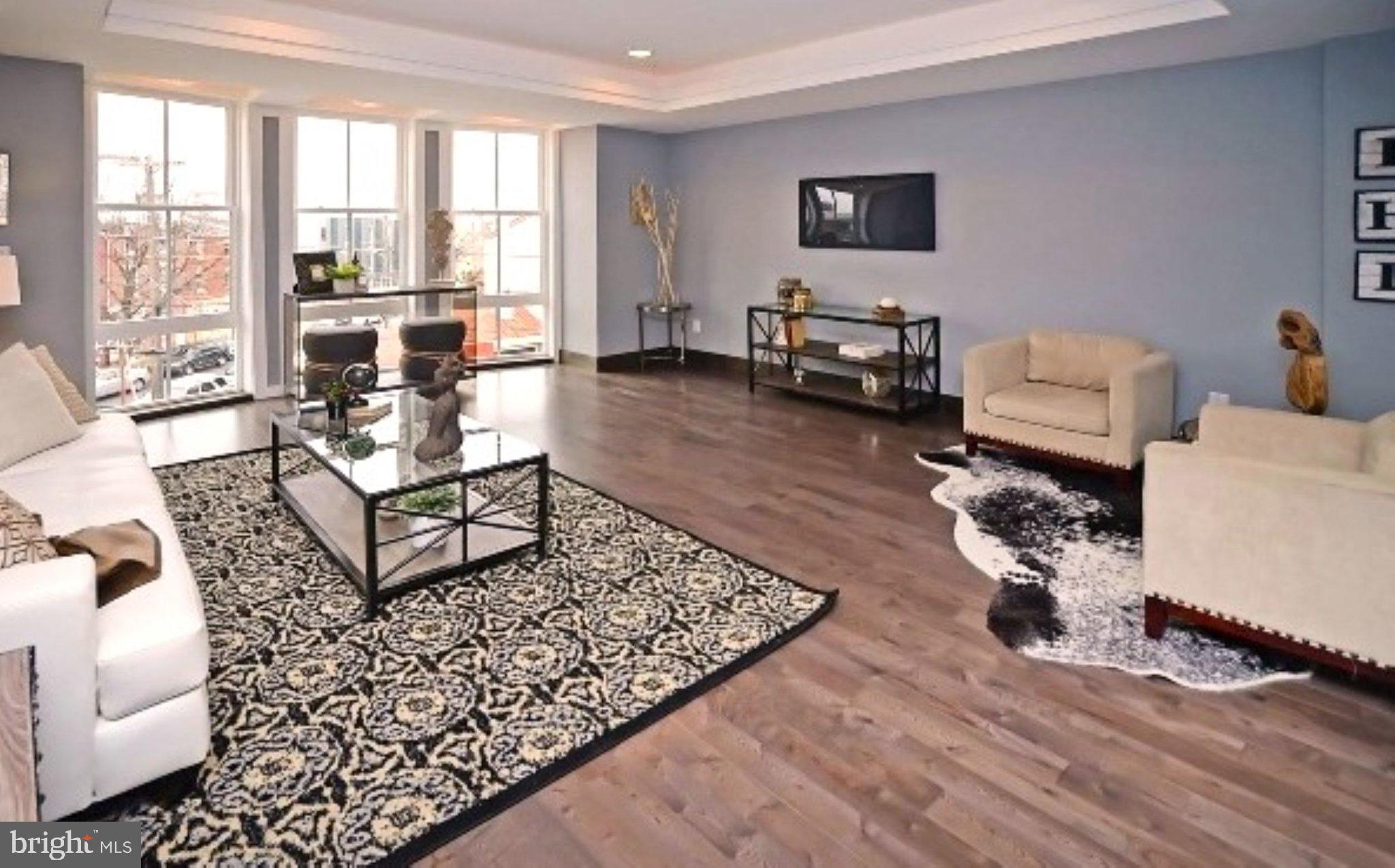 This modern 3-bedroom, 2.5-bathroom home is nestled in one of Philadelphia's most coveted neighborhoods. Not only is the location highly desirable, but this one of a kind condo is stunning, one you have to see to fully appreciate. The unit was just freshly painted for the new owners to enjoy!   
The top-floor, bi-level unit is adorned with rich dark walnut flooring, creating a warm and inviting atmosphere and features almost 650 sq ft of outdoor space!! Entering through the front door, you’ll be welcomed by the abundance of natural light flooding the open floor plan, enhancing the spaciousness and comfort of the living space. The kitchen is a chef's delight, with modern stainless steel appliances, including a handy trash compactor to streamline your cooking experience, quartz counters and plenty of cabinet and counter space to fulfill all of your needs. There is also a breakfast bar for additional seating options. The kitchen flows effortlessly to the spacious living area featuring impressive floor-to-ceiling bay windows with automated blinds. This bright and airy space offers endless layout options and will surely be one of your favorite spaces in the home. Head to the second level where you will discover a generous primary bedroom complete with its own private en-suite bathroom and a walk-in closet for all your storage needs. The two additional bedrooms are thoughtfully designed with expansive windows that invite plenty of natural light in, while also featuring room-darkening blinds to create a cozy, dark atmosphere when it's time to rest. The hall bathroom conveniently separates these two bedrooms, ensuring privacy and comfort. Furthermore, this level also includes the convenience of having an in-unit washer and dryer, making laundry days a breeze. This thoughtful layout not only enhances the functionality of the space but also contributes to a more relaxed living experience. A truly exceptional feature of this home is the large private roof deck, which presents stunning panoramas of the city, the Ben Franklin Bridge, and the entire Fishtown area. This expansive outdoor space is almost 650 sq ft and serves as a perfect retreat for relaxation or entertaining. This home is just steps away from all of the Fishtown favorites: Frankford Hall, WM Mulherins, Suraya, La Colombe, Pizzeria Beddia, City Fitness, and more! Just a few blocks from the Market-Frankford line and easy access to the Ben Franklin Bridge and I-95, the convenience factor of this home is key. 
Don’t miss this opportunity! Schedule your showing today!
**Note: Pictures and virtual tour were from when the unit was previously occupied. It is now vacant.**
Please view the virtual tour!