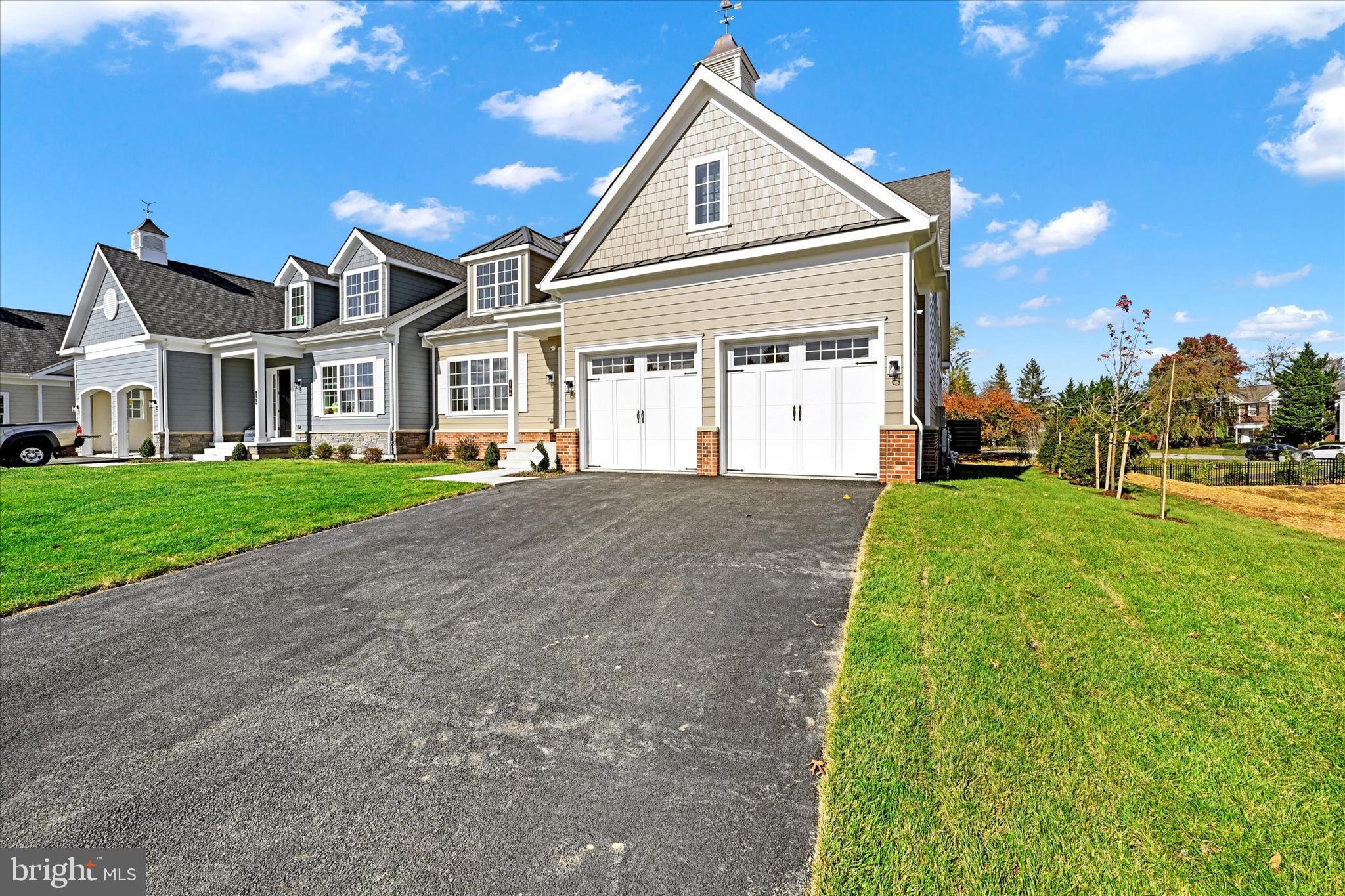 This Forge model, built on lot 13, offers 5 bedrooms and 3.5 baths with over 5,000 sq/ft of finished living space, an optional covered/screened-in porch, gas fireplace, study on the main floor along with a private rear deck.  You will find 4 beds and 2 baths on the second floor and an optional, large, fully finished basement with an additional bedroom and a full bath.  Call for the latest sales incentives and lot availability within the community! We are now in our very final phase of the community. 

Welcome to Villas at Woodbrook - a luxury carriage home community! Our six modern carriage home elevations offer a fresh take on traditional living in an unbeatable location. All 30 homes in this new community will feature 2-car garages, 9-foot ceilings on the main level, open-concept floor plans, and a long list of sleek finishes. Large windows allow for abundant natural light, complemented by enhanced technology and energy-efficient options. Each floor plan has its own unique charm and character, with options that include first-floor owner’s suites or traditional second-floor owner’s suites. Living spaces range from 3,283 to 3,770 sq ft. Contact our sales team today for more information or to set up a private consultation. THIS IS A COMMUNITY LISTING. PHOTOS ARE OF THE MODEL HOME.
