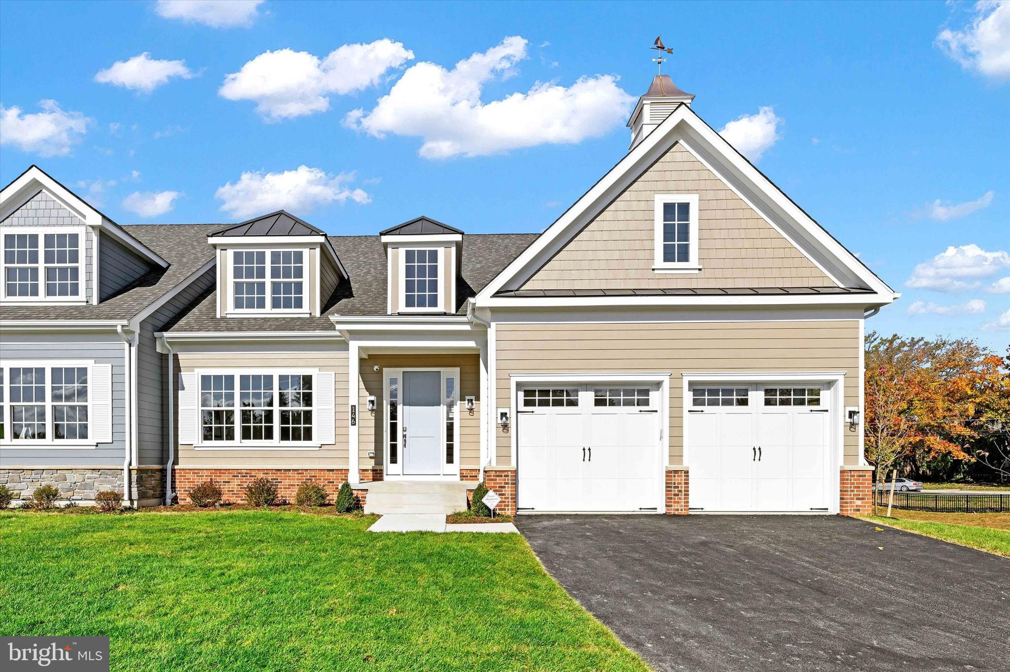 This Forge model, built on lot 13, offers 5 bedrooms and 3.5 baths with over 5,000 sq/ft of finished living space, an optional covered porch, gas fireplace, study on the main floor along with a private rear deck.  You will find 4 beds and 2 baths on the second floor and a large, fully finished basement with an additional bedroom and a full bath.  Call for the latest sales incentives and lot availability within the community! 

Welcome to Villas at Woodbrook - a luxury carriage home community! Our six modern carriage home elevations offer a fresh take on traditional living in an unbeatable location. All 30 homes in this new community will feature 2-car garages, 9-foot ceilings on the main level, open-concept floor plans, and a long list of sleek finishes. Large windows allow for abundant natural light, complemented by enhanced technology and energy-efficient options. Each floor plan has its own unique charm and character, with options that include first-floor owner’s suites or traditional second-floor owner’s suites. Living spaces range from 3,283 to 3,770 sq ft. Contact our sales team today for more information or to set up a private consultation. THIS IS A COMMUNITY LISTING. PHOTOS ARE OF THE MODEL HOME.