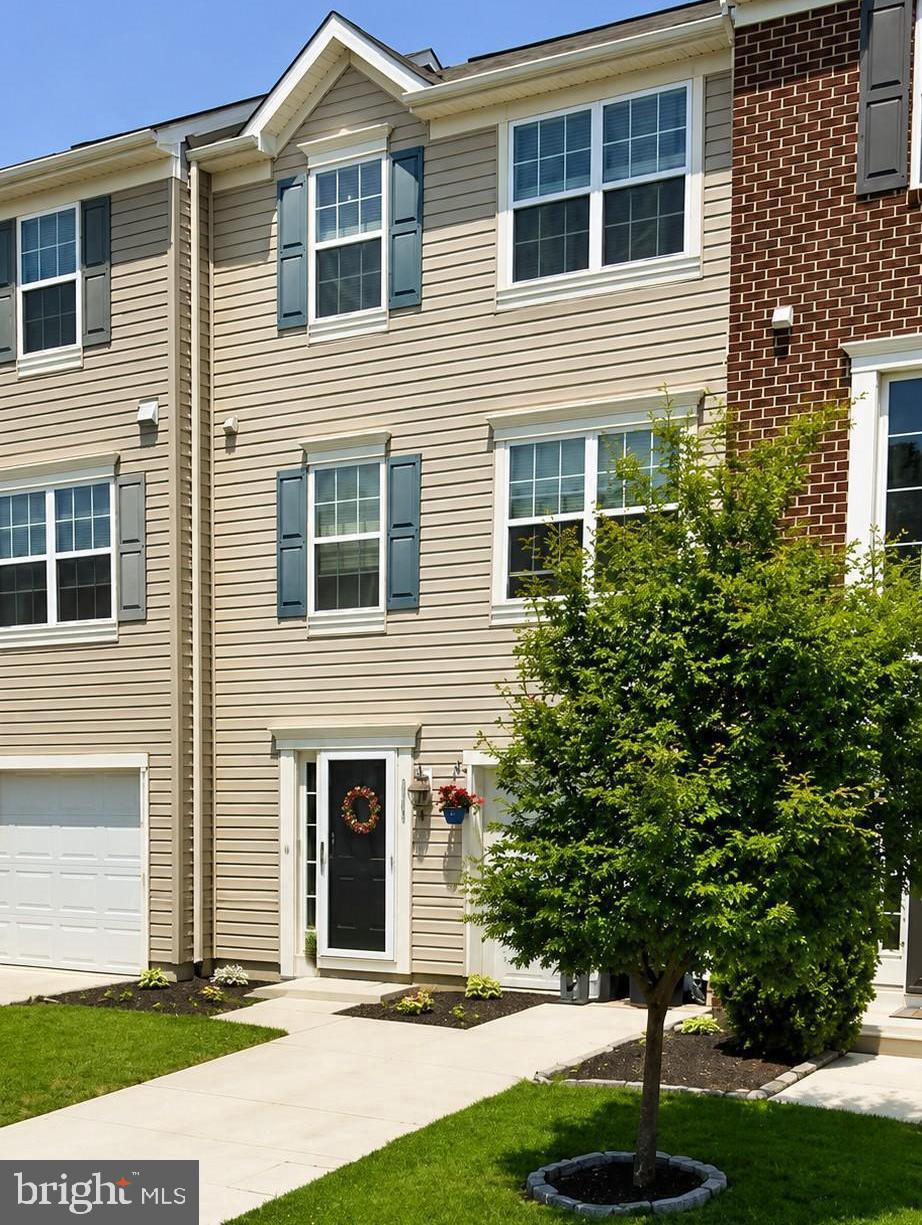 Professional Photos will be uploaded soon! 

Welcome to this beautifully maintained three-level townhome offering 3 bedrooms, 2 full bathrooms, 2 half bathrooms, and a one-car garage. The entry level features a versatile flex space that's perfect for a family room, home office, playroom, or home gym, along with a convenient half bath and interior access to the garage.

The main living level boasts an open-concept design that's perfect for both everyday living and entertaining. The spacious kitchen is the heart of the home, featuring a large center island with seating, abundant cabinetry, generous counter space, hardwood flooring, and plenty of natural light. The kitchen flows seamlessly into the dining area and living room, creating an inviting space for gathering with family and friends. An additional half bath completes this level.

Upstairs, you'll find a spacious primary suite complete with a walk-in closet and private en-suite bathroom, along with two additional bedrooms and a full hall bathroom.

Ideally situated just minutes from I-695, I-95, shopping, dining, and everyday conveniences, residents also enjoy access to community walking trails, lakes, a beach area, and the popular Hard Yacht Café. Combining space, functionality, and an unbeatable location, this move-in ready home is ready for its next owner.