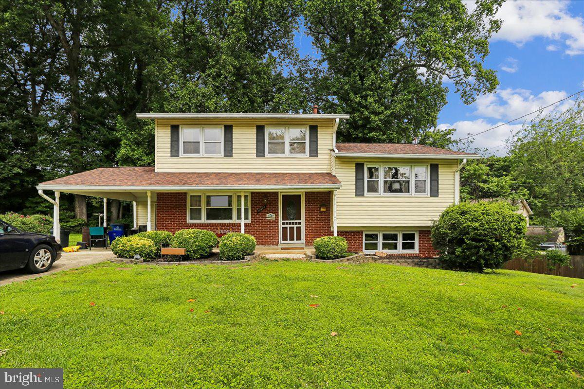 Spacious 5-Level Home with Numerous Updates and Exceptional Living Space

Welcome to this well-maintained 5-level home offering abundant living space, functional design, and numerous recent updates for added peace of mind.

The main level features a bright living room, formal dining room, and an inviting kitchen with dual entry points, making entertaining easy and convenient. The kitchen is spacious enough to accommodate a breakfast table with seating for four. Recent kitchen updates include a new dishwasher and stove installed in 2025. The refrigerator, approximately seven years old, is in excellent working condition, and the ice maker was serviced in May 2026.

Just a few steps down, the first lower level offers a large family room, perfect for relaxing or gathering with family and friends. This level also includes a convenient half bath and a mudroom with a freezer that conveys with the home. The mudroom provides direct access to the backyard.

The next lower level features a partially finished basement with plenty of flexible space for recreation, hobbies, or a children's play area. There is ample room for a full-size pool table, shuffleboard, or additional entertainment options. This level also houses the HVAC system (replaced in 2015), hot water heater (replaced in 2021), and laundry area with a Kenmore washer and Maytag dryer.

On the upper levels, you'll find a spacious primary bedroom with double closets and a private full bath with shower. An additional bedroom on this level can serve as a guest room, home office, or den. The top level features three more generously sized bedrooms and a second full bath. Both full bathrooms have been updated within the past several years.

Outside, the property offers attractive landscaping with front porch shrubs and plenty of space to add seasonal flowers and garden features. A storage room located at the rear of the carport includes shelving and pegboard, providing excellent organization for tools and equipment.

Additional major updates include:

Main sewer line replaced in 2022
New roof installed in 2023
HVAC system replaced in 2015
Hot water heater replaced in 2021
Dishwasher and stove replaced in 2025

Conveniently located near schools, shopping, and everyday amenities, this home offers easy access to grocery stores, retail shopping, restaurants, government services, and commuter routes.

With its versatile floor plan, multiple living areas, and extensive updates, this home is ready to welcome its next owners.