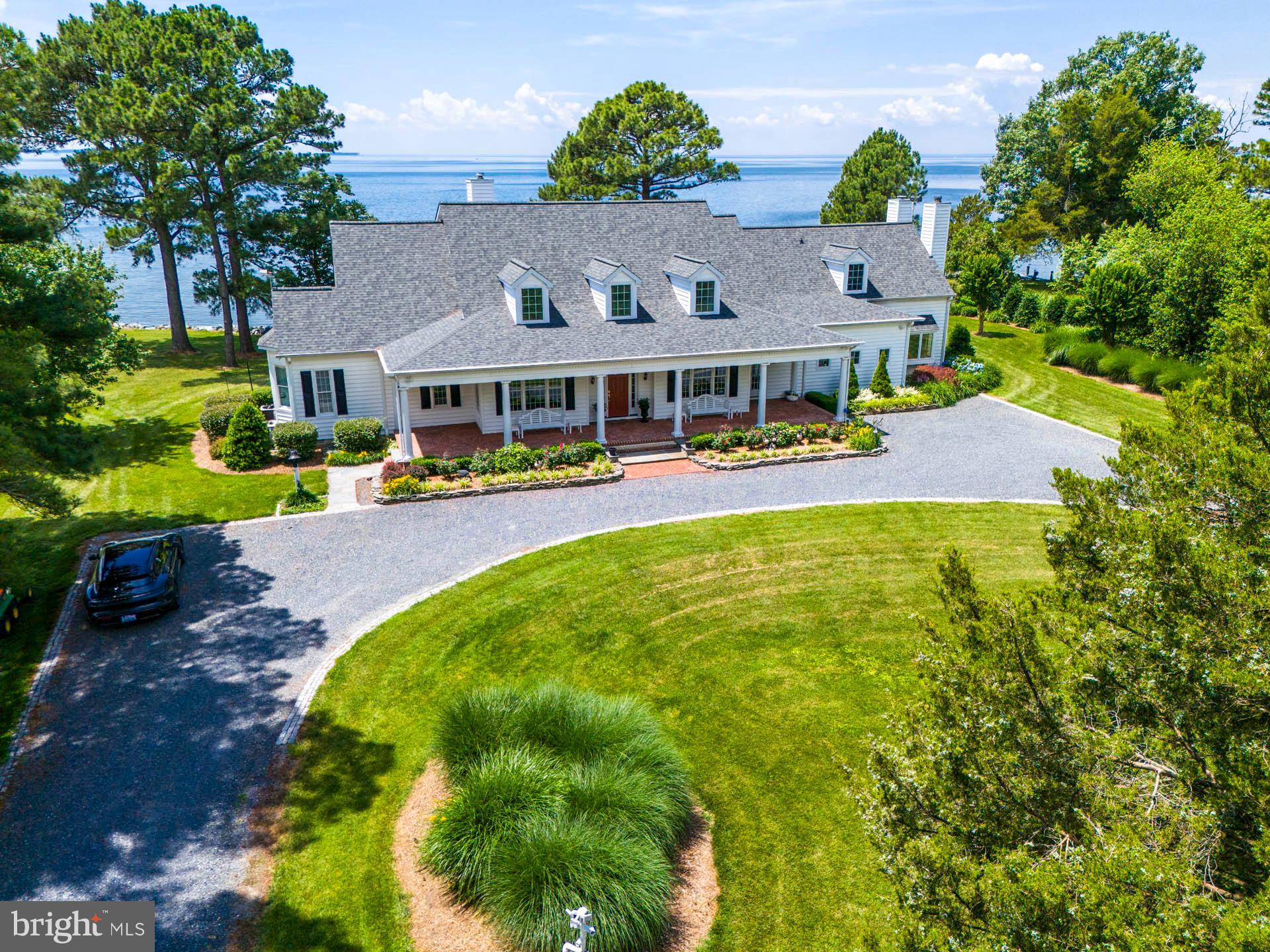 “Overlook Farm” - Southern Cape on the Choptank River, this 54+/- acre gentleman's farm offers one of the best broad water sunset views on the Eastern Shore of Maryland. This property is conveniently located between Easton and St. Michaels and Oxford (via Bellevue Ferry) and offers an idyllic setting with privacy and a combination of mature woodlands and farm fields. The 4 bedroom, 4.5 Bath home includes large living spaces, 9’ ceilings, hardwood flooring throughout, a large living room with fireplace, separate dining and private office, a family room off of the kitchen, a sunroom, cozy study with fireplace and a generous size laundry/mudroom. There is a first-floor primary suite with walk-in closet, bathroom with double vanity, soaking tub, separate shower. The second floor includes three private bedrooms and a huge Rec Room with balcony on the waterside. The farm has an abundance of wildlife including deer, turkey, ducks, geese, foxes, Eagles, and other waterfowl, a great hunting farm or place to enjoy nature! There is approx. 800’ +/- of natural and protected shoreline, a recently built pier, a boat lift, electric and water, with 3’+/- MLW. The property is further improved with a 60’ x 40’ barn, a detached 2+ car garage, a pond, an off-shore duck blind, and professional landscaping. The open water view extends off the Choptank River, across to the western shore of the Chesapeake.