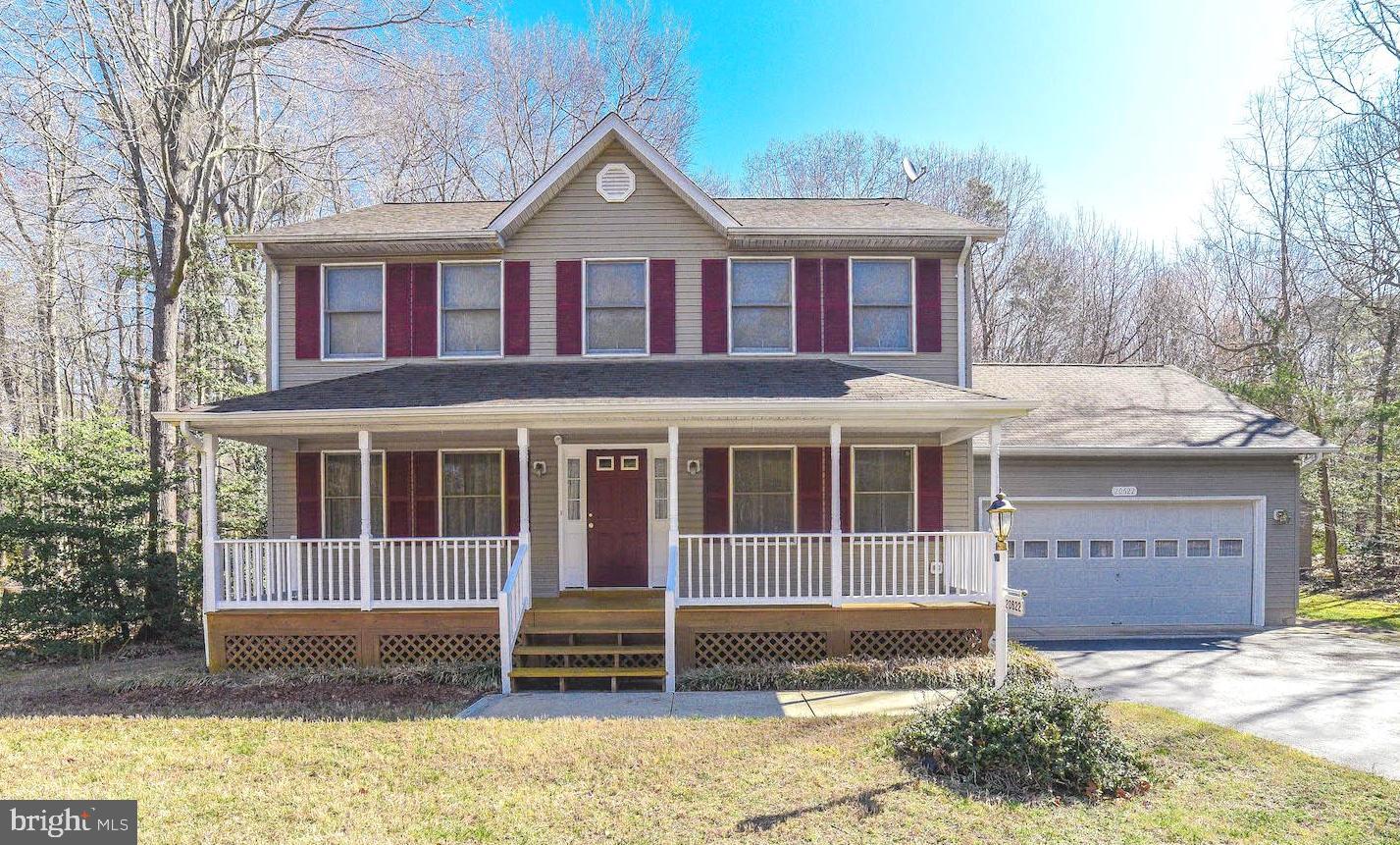 Private & Convenient! Come see this lovely home on a quiet street away from it all, yet close to everything. An inviting front porch will welcome you home. Gleaming hardwood floors guide you to an eat-in-kitchen open to the family room with space for everyone. A formal dining room and a living room or office complete the main floor. Upstairs is a master suite with an attached bath and big walk in closet plus two additional large bedrooms. The laundry room is upstairs too, so no more clothes to lug up and down.  This well maintained home sits on 1.53 acres making plenty of room to play in the flat rear yard that backs to trees.  Step out to the recently stained deck from the family room for indoor/outdoor entertaining. A 2-car garage and 2 sheds provide plenty of storage.  Easy commute to PAX, shopping and restaurants. Home warranty included.