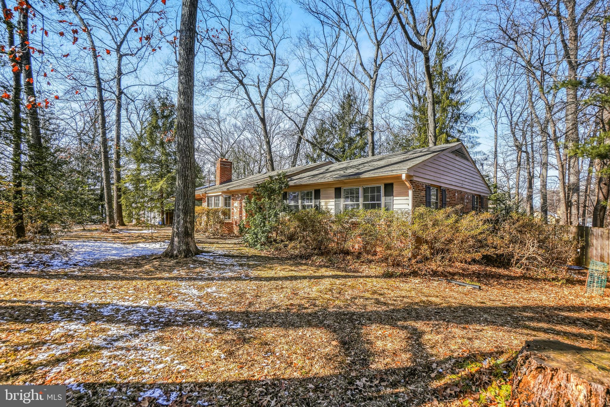 Rare opportunity to own an affordable home in prestigious Luxmanor, an exclusive community where neighboring homes frequently command $2M - $3M or more.  Perfectly situated on a beautiful .48 acre wooded lot, this solid brick rambler is a true "diamond in the rough" with incredible bones and the potential for immediate equity. The main level features four bedrooms, two full baths, and a fireplace-warmed living room. The dining area opens to the kitchen and a sun-drenched rear addition, perfect for morning coffee while overlooking the park-like backyard. Recent updates include fresh paint, new carpet and several other updates. The kitchen and bathrooms are ready for you to reinvent them according to your own vision. The flexible lower level, complete with a full bath, interior & exterior access, is ideal for a variety of uses, home gym, office, guest suite, creative studio, or whatever you like.  Just steps from Tilden Middle, Luxmanor Elementary.  With Pike & Rose, Whole Foods, North Bethesda Metro, NIH, Walter Reed, Tilden Woods Pool, KS Aquadic Center,  just moments away, this property offers unbeatable opportunity to create your dream home in a premier neighborhood at a reasonable price.