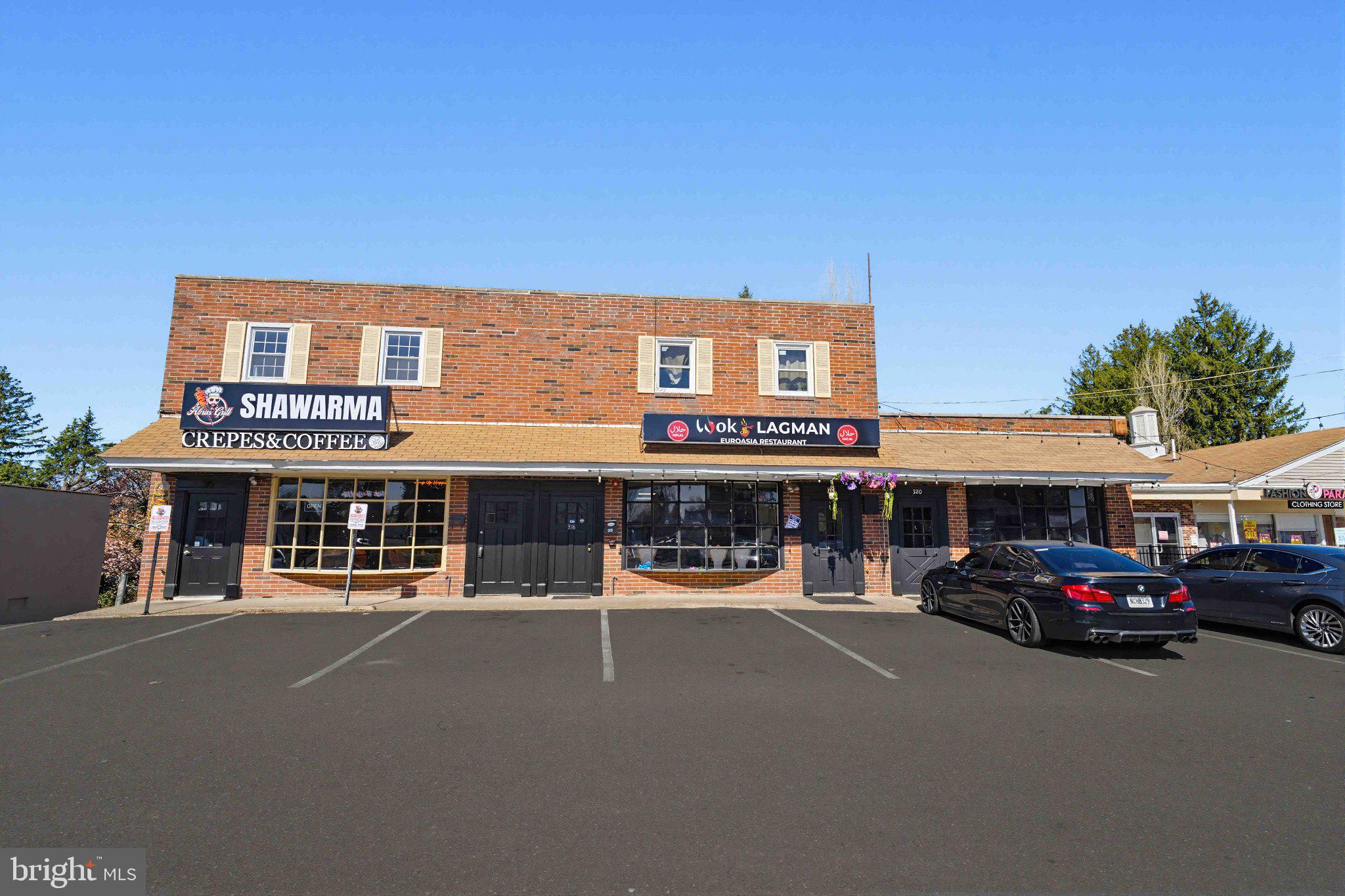 Fully leased mixed-use investment opportunity on a high-traffic, high-visibility corridor with strong street presence and prominent storefront exposure. This income-producing property consists of three ground-floor commercial spaces with full basements, ample surface parking and two second-floor residential apartments, each offering 2 bedrooms and 1 bath. The effective annual gross rent of $156,885 provides a NOI of approximately $115,000, creating strong in-place cash flow for an investor seeking a stabilized asset with diversified income streams.