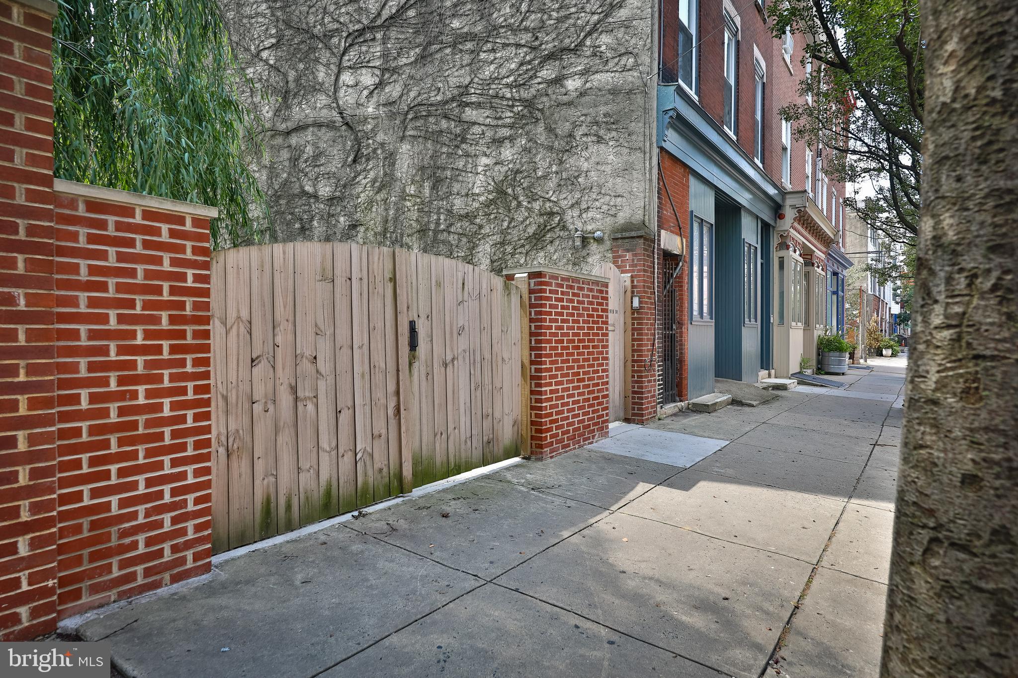 INCREDIBLE VALUE - LOOKING for a huge lot 23 x 98,  currently utilized as a garden PLUS a Duplex 3 story building in a popular and desirable area of Queen Village/Bella Vista.  Could be a conversion to a unique single family home,  or live in one unit currently and rent out the other. Or rent out both units and maybe  build on the lot in addition.  Enter through gate and walk down brick path passing impressive weeping willow tree and plants,  through courtyard set up to accommodate 2 car parking (curb cut - see note below) plus terrace in a peaceful urban oasis far from the madding crowd.   ADJACENT stands 3 story building 100 x 23 duplex - 1st floor, a magnificent, New York style live/work space in popular Queen Village/Bella Vista neighborhoods.  Layout provides perfect balance of professional and personal life. Pass through  over-sized sliding doors and you are surrounded by sleek modern designed space polished concrete floors and radiant heat, 11' high ceilings, 2 large skylights visually connecting trees and vegetation, bringing in sunshine and air and blurring boundaries between office and nature and living space. This area easily converted into sleeping quarters plus the creation of a living room overlooking the unique, wondrous garden. European style kitchen features luxurious appliances Liebherr fridge, Bosch convection oven, dishwasher, and microwave, Grohe, large pantry with custom built ins and cabinetry. Gorgeous white pine flooring separates dining area with a buon fresco, by local artist surrounding the center wall opening bordering kitchen.  Right of kitchen is a full bathroom, designer quality toto, grohe, kohler complimented by crisp white subway tile, plus laundry room  Bosch washer/dryer and custom built ins.  Second full new contemporary bathroom plus a hall closet and an additional large room, with high ceilings that could be utilized as an office or second bedroom or STUDIO.  Generous closet space provided throughout.  Currently vacant and has been rented at $2,750 in past few years.  AND THERE IS MORE.  a 3 bedroom unit occupies the 2nd and 3rd floor, spacious living area, offset by contemporary sleek kitchen,  2 bathrooms,  loads of light cascading through skylights and decks galore, plus potential for a skyline panoramic view from the roof with replacement of spiral stairs. Come and explore the possibilities of the most Outdoorsy live, work space ever and just live........here. Currently rented at $2500 (Long term tenant - rent under market). Will need to go through zoning appeal process for parking - should be easy with attorney.