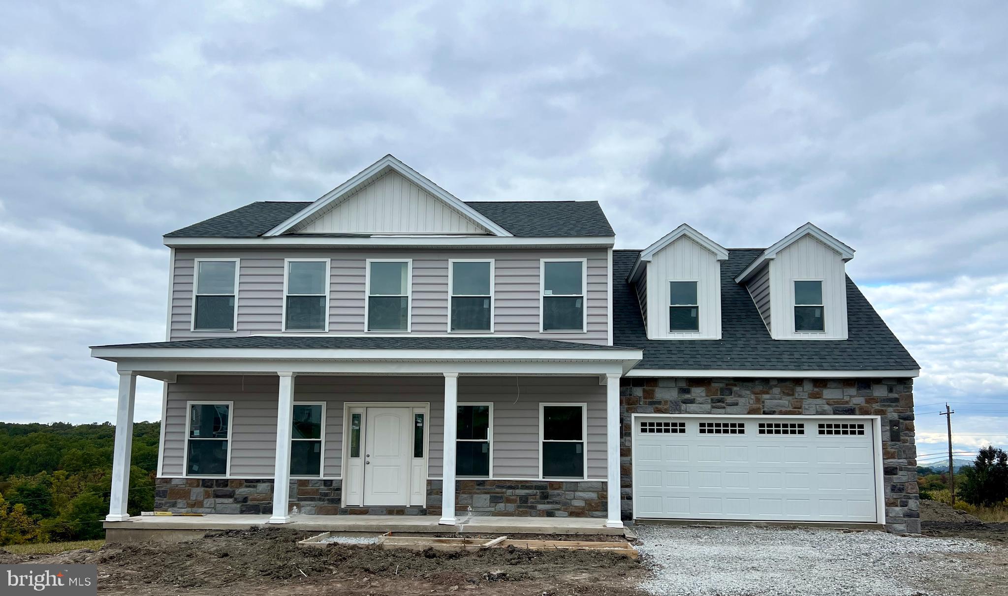 The "Paris" model is under construction - ready in mid November- still time to  make selections.  You must see this home in person  -the view from the rear of the home is breathtaking!!!  Features over 2300 SF, 4 bedrooms, 2 1/2 baths, full walkout basement.  There is an oversized kitchen with an abundance of quality cabinets, granite countertops, stainless steel appliances and oversized island with dishwasher and sink.  Elegant formal dining room, 9 ft ceilings and an open floor plan for easy entertaining. Expansive family room with a gas fireplace.  You can enjoy the view from the family room or breakfast area in kitchen.  The Owner's suite features an ample size walk-in closet, large luxurious bath with a tile shower & stand alone  tub, comfort height double vanity and tile flooring. This fantastic new home community is located just 4 minutes from I-83.  Quality new home construction by EXCEPTIONAL HOMES.   Visit us and learn why BUILDING NEW IS FOR YOU!