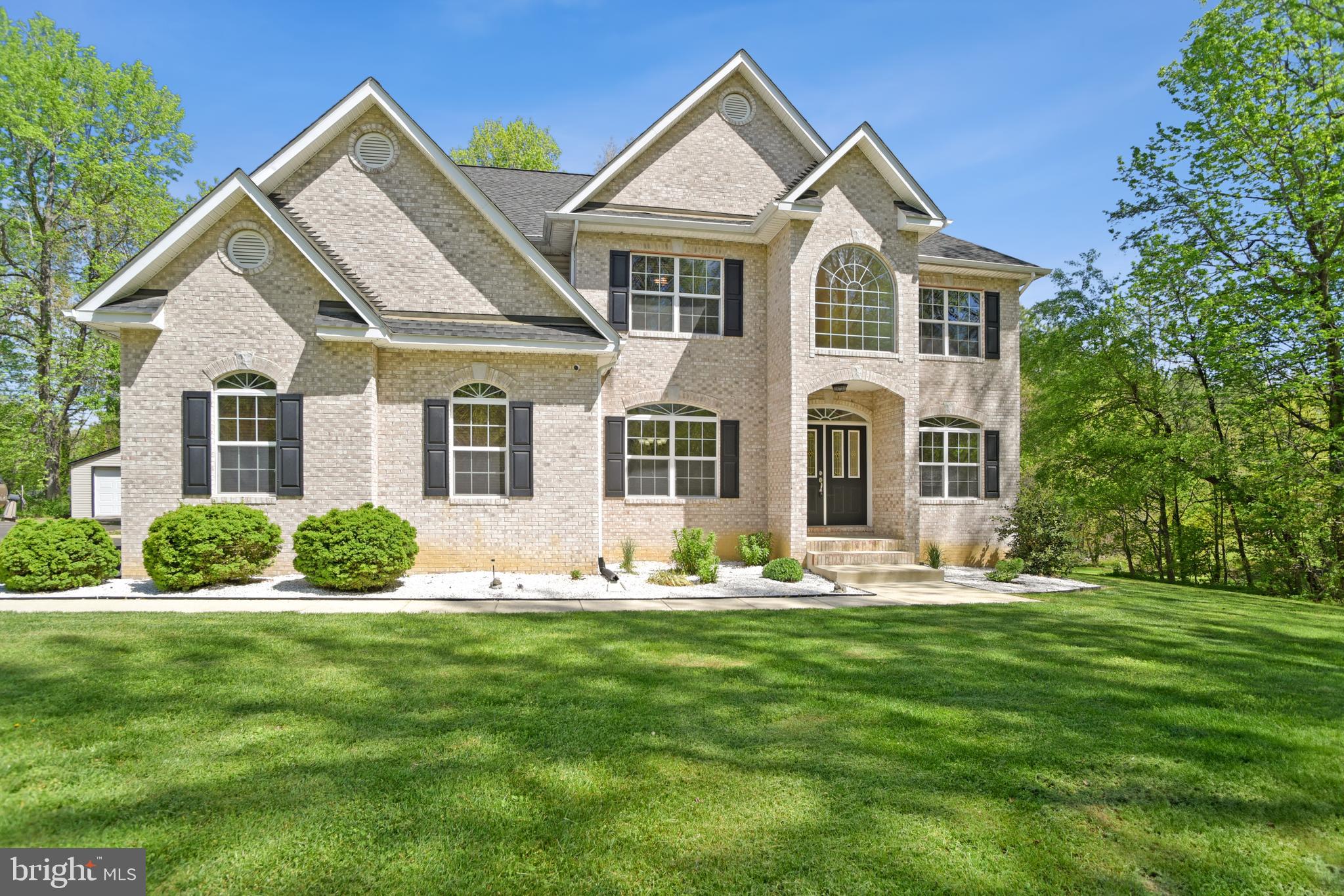 Welcome to 14010 Arnette Place in Charlotte Hall — a private retreat set on over 3 beautiful acres, offering space, comfort, and exceptional amenities both inside and out.

This impressive 5-bedroom, 4.5-bathroom single-family home features an attached 2-car garage, a detached 1-car garage, and an expansive driveway with room for four additional vehicles — ideal for guests, hobbies, or multi-generational living.

Step inside to find gleaming hardwood floors and a thoughtfully designed main level that includes a spacious living room, formal dining room, and a sunken family room with a cozy fireplace just off the kitchen. The kitchen is a true centerpiece, complete with stainless steel appliances, double ovens, cooktop, and a large island perfect for gathering and entertaining. A main-level bedroom and half bath provide flexibility for guests or home office needs.

Upstairs, the primary suite is a luxurious retreat featuring tray ceilings and a spa-inspired en suite bath with soaking tub, separate shower, and dual vanities. Three additional bedrooms and three full bathrooms complete the upper level, offering comfort and privacy for everyone.

The finished basement expands your living space with a full bathroom, wet bar, theater room, dedicated workout area, and walk-up access to the backyard.

Recent updates and premium features include a Generac 24kW whole-house generator, Generac Level 2 EV charger (2025), new basement HVAC (2025), and a roof replaced in 2020.

Outside, enjoy your own private oasis with a basketball court, covered picnic area, and two large sheds for additional storage.

This exceptional property combines modern convenience, spacious living, and outdoor enjoyment — all in a peaceful Charlotte Hall setting. Mortgage savings may be available for buyers of this listing.