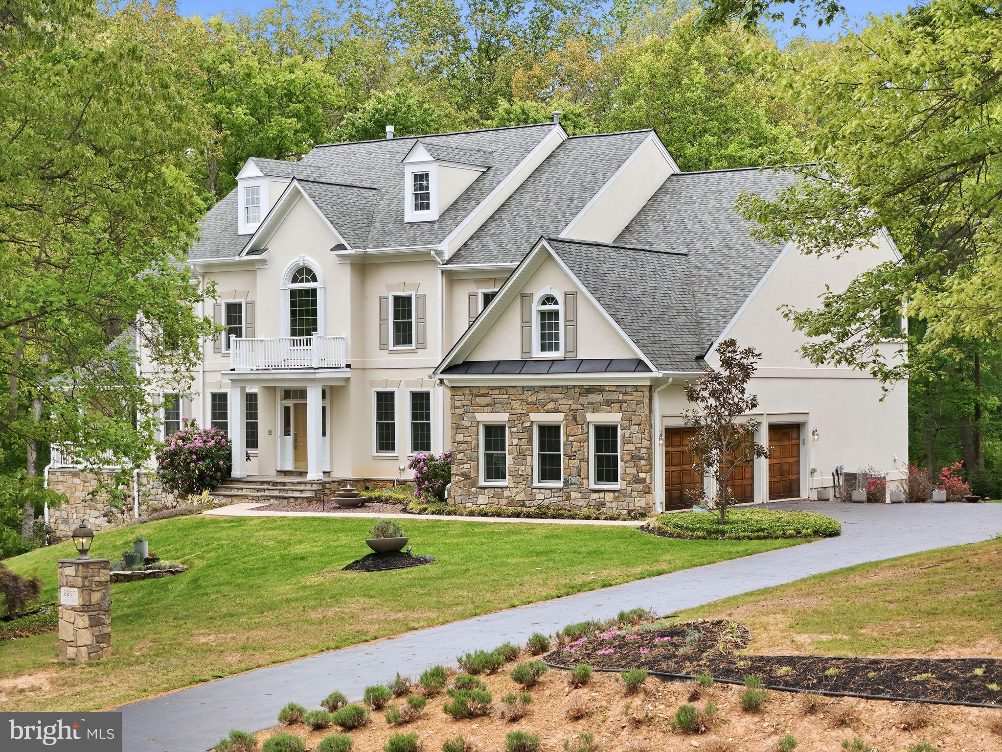 Welcome to 2207 Aryness Drive—an exceptional opportunity to own a remarkable home in one of Vienna’s most coveted neighborhoods, where expansive homes, mature lots, and timeless appeal create a truly special setting.
Set on a rare and private 1.72-acre lot, this Renaissance Built property offers over 8,700 square feet of living space and an outstanding floor plan designed for both everyday comfort and elegant entertaining. For buyers who appreciate space, privacy, and an exceptional location this home offers the perfect blend of comfort and the prestige of the surrounding neighborhood.
A dramatic two-story foyer welcomes you inside, where generous formal living and dining room provide the ideal backdrop for gatherings and special occasions. The sun-filled family room is the heart of the home, featuring soaring vaulted ceilings, a cozy fireplace, and oversized picture windows overlooking the peaceful rear grounds. Miles of creek lined wooded trails are just steps from the property. 
The spacious kitchen offers a large center island, granite countertops, and abundant workspace, flowing seamlessly into the bright sunroom—a wonderful place to relax and enjoy views of the property. A private library/home office adds flexibility for work or quiet retreat.
Upstairs, dual staircases lead to four spacious bedrooms, each with access to en-suite baths. The primary suite is a true retreat, complete with a sitting area, fireplace, and a spa-like bath tub overlooking the lush landscape.
The fully finished 3100 + sf walk-out lower level expands the home's versatility even further with a second kitchen area,  two additional bedrooms , a full bath, office space, second laundry area and abundant space for recreation, guests, or multi-generational living.
Outside, the possibilities are endless. The expansive 1.72-acre homesite offers privacy, mature surroundings, a fire pit, two storage sheds, and ample room to create your dream outdoor oasis—whether that means a pool, gardens, entertaining spaces, or simply room to roam.
Located in one of  Vienna's premier settings, 2207 Aryness Drive is a rare offering that combines impressive scale, timeless design, and an exceptional lifestyle opportunity. Madison HS/Thoreau MS/Oakton ES pyramid