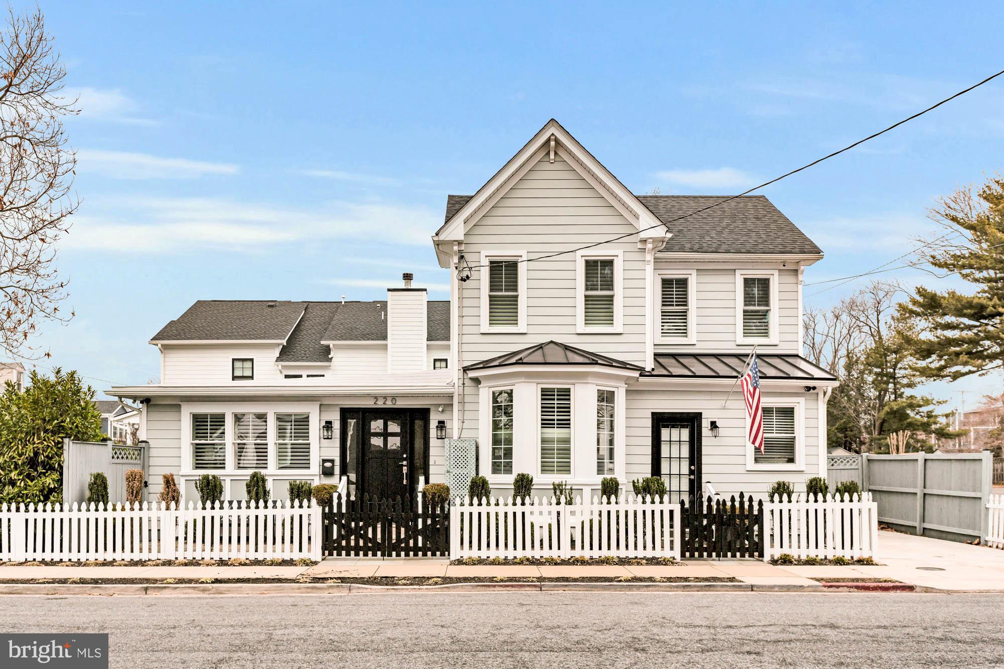 220 Chesapeake is an "Urban Oasis", located in the hub of the Eastport Peninsula.  Originally built in 1900, this property has had several reincarnations as a commercial hair salon with living quarters to a private residence. The home was completely renovated in 2019 creating an open floorplan on the main level.  The current owner took it to the next level creating a beautiful outdoor space on the side and rear with hardscaping, decks and lush plantings.   Tall healthy Skip Laurels adorn the perimeter of the side yard offering a natural privacy screen.   A summer blooming hydrangea garden, rose bushes, boxwood and shrubs create a lovely yard without high maintenance.   Very nice entertaining areas both on the side and backyard.  Completely fenced in yard with white picket fence on the front of the house.
The interior offers an open floorplan with a half wall between the living and room and kitchen to define the space.  Living room is cozy and elegant with a gas fireplace with heatilator and mantle.  The updated kitchen includes updated appliances, natural gas stove, massive quartz island/countertops with casual dining for 6 people.  Formal dining room can accommodate 10 people and additional are for more intimate dining or game playing area such as bridge or Mah Jong.  The main level has two smaller rooms that can be used as sitting/tv/reading rooms, an office or main level bedrooms with shared Jack and Jill bathroom.
A purposeful mudroom with entry next to driveway, easy for grocery unloading.
Stunning primary bedroom that looks like fine European boutique hotel bedroom with two walk ins and large primary bathroom with walk in shower.  Second bedroom is ensuite.
Lower level can be used as a recreational room, extra bedroom, hobby room.  Loads of storage space.

This house is seriously special and a perfect location in Eastport with privacy and parking!  Complete walkability to restaurants, water taxi pickups, yacht clubs, Annapolis Maritime Museum, marinas and to downtown Annapolis.  Ideal property for those who want an urban setting with gardens, entertaining areas, and low maintenance!  
For floorplans and dimensions, refer to the website link.