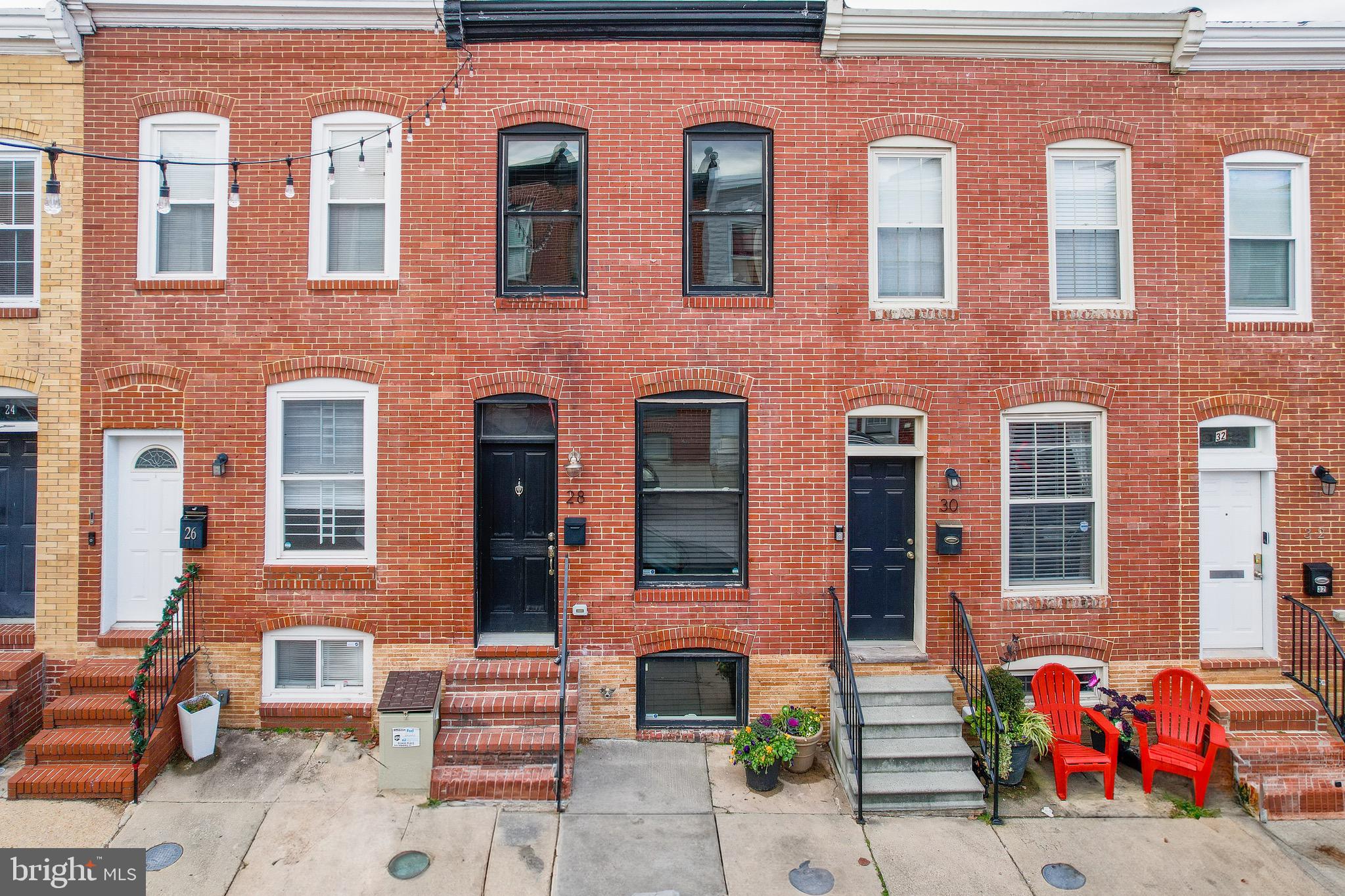Welcome to 28 N Curly Street, a beautifully renovated 1920s home offering 3 bedrooms and 2 baths across 1404 sq ft. With hardwood floors, stainless steel appliances, and a fully finished basement, this residence seamlessly combines historic charm with modern comfort. The property boasts excellent condition with significant renovations in 2013. Enjoy designated outdoor space for parking or create your own outdoor retreat. Located on a quiet one-way street, just steps from Patterson Park, and within walking distance to downtown amenities. No HOA fees, SMART features throughout, a jetted bathtub, exposed brick, and a bonus flex room add to the appeal. Don't miss the chance to call this Baltimore gem home!