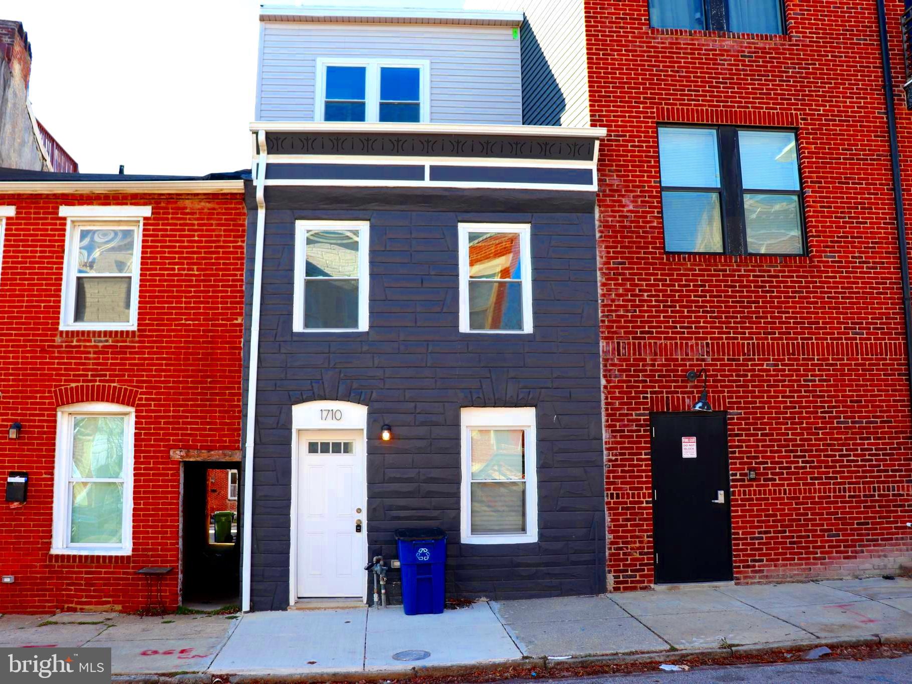 Discover an exceptional urban retreat at 1710 Light Street, a completely reimagined luxury townhome in the heart of Federal Hill. Fully remodeled with all permits pulled and finalized, this residence offers a refined blend of modern sophistication, thoughtful design, and premier city living—where every detail has been carefully curated.

Boasting 3 bedrooms, 3.5 bathrooms, and an intelligently designed multi-level floor plan, this home is equally suited for elegant entertaining and everyday comfort.

Elevated Interiors & Thoughtful Design

The first level welcomes you with a spacious family room, dining area, and a beautifully appointed open-concept gourmet kitchen. Designed as the heart of the home, the kitchen features sleek cabinetry, stainless steel appliances, expansive counter space, and a statement island, ideal for both casual mornings and elevated gatherings. From here, step into the private covered patio, a rare, rainproof outdoor space perfect for year-round entertaining—add lounge seating, a TV, or create your own outdoor living room.

The second level offers a versatile layout with a private guest or “princess” suite featuring its own full bath and walkout deck, a third bedroom, an additional full bathroom, and a conveniently located laundry room—providing comfort, privacy, and functionality.

The third level is dedicated to the primary suite, a true sanctuary complete with a walk-in closet and spa-inspired ensuite bath. Just outside the suite, a wet bar and half bath create the perfect prelude to the showpiece rooftop deck, where panoramic skyline views set the stage for sunset cocktails, entertaining under the stars, or quiet moments above the city.

Exceptional Outdoor Living

Private covered patio (rainproof and entertainment-ready)

Expansive rooftop deck with breathtaking Baltimore skyline views

Prime Federal Hill Location

Set along iconic Light Street, this home places you moments from Federal Hill Park, Cross Street Market, the Inner Harbor, waterfront activities, stadiums, and some of Baltimore’s best dining, nightlife, and boutique shopping. With easy access to public transportation and major commuter routes, the location is as convenient as it is vibrant.

Why You’ll Love It

This is more than a home—it’s a lifestyle. With brand-new systems, upscale finishes throughout, and a layout designed for modern urban living, 1710 Light Street offers turnkey luxury in one of Baltimore’s most desirable neighborhoods.

Whether you’re a discerning city professional, a design-forward buyer, or an investor seeking a premium asset, this residence is a rare opportunity.

Schedule your private tour today and experience Federal Hill luxury at its finest.