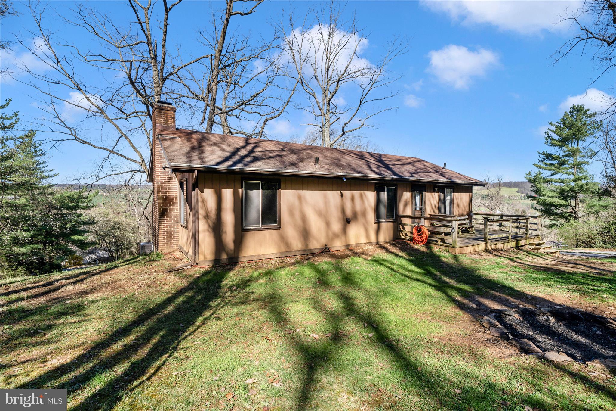 Hurry over to check out this 3-4 Bedroom, 1.5 Bath Rancher situated on a partially wooded lot.  This home offers a lovely updated  kitchen with lots of cabinet space.  The living room has updated flooring, a vaulted ceiling and tons of natural light.  The fully finished walk-out level basement offers space for a possible bedroom, a home office , laundry area, a wood stove and more! Outside you will find mature trees for privacy, a large wrap around deck perfect for grilling out and entertaining your friends and family! ** Property is USDA Financing eligible **