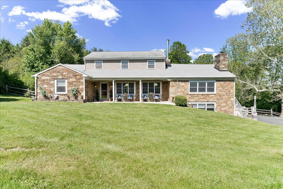 Spectacular 6 bedroom, 3 full bath classic stone colonial home with a lovely main level in law suite and lots of indoor and outdoor spaces; perfect for multigenerational living, larger families and any social or holiday gathering; nestled on a beautiful tree lined 1.2 acre lot that can accommodate that post barn, swimming pool, or other structure you've always dreamed about, and is surrounded by lots of lush landscaping for privacy, all in the beautiful rolling hills of Concord Township and the top rated Garnet Valley School District. Just around the corner from the Garnet Valley School campus, Concord Township Park, walking & running trails, dog parks, the Rachel Kohl Library, Brandywine Youth Club Field House and practice fields, shopping, and commuting routes to corporate centers, airports, train stations, Philadelphia, Wilmington, NYC and more. From the moment you pull into the driveway of this exceptional home at 779 Concord Rd, the classic charm shines through with thoughtful updates and upgrades over the recent years with careful attention to detail and preservation of the home's classic beauty.  A welcoming covered front entry porch walks into a functional floor plan featuring a tiled foyer and a large bright sun filled formal living room with two triple pane bay windows, a stone fireplace, hardwood floors that flow throughout the main level into the recently updated gourmet kitchen and dining room/breakfast room. The exquisite updated kitchen features a granite island/breakfast bar, stainless appliances, 42" cabinets, a double pantry, and self-cleaning double oven. French doors walk out to a large Trex deck with breathtaking views out over the lovely private backyard and is perfect for outdoor dining and entertaining. Completing the main level of this fantastic home; a primary bedroom with its two large walk in closets (and room to add a private en-suite bath by converting one of the closets if preferred), an additional spacious bedroom with a walk-in closet, an updated hall bath featuring beautiful tile, a full in law suite with its own private entrance, a spacious bedroom, adjacent updated full bath and a spacious central sitting room featuring hardwood floors, a beautiful classic stone fireplace and a triple pane bay window looking out over the lovely front yard. The in-law suite is accessible via the main living room area of the main home and also has three separate exterior entrances including access via the covered front porch, a separate side stairway, and via the lower level finished den off from the oversized two car side entry garage which affords potential to add a chair lift if desired. There is also a centrally located laundry on the main level that is also accessible to the in-law suite for added convenience. On the upper level is a dramatic great room with soaring cathedral ceilings and recessed lighting, 3 additional spacious bedrooms, a play / hobby room, a sitting room area that is also ideal for a home office, hobby space, or additional family bedroom and an adjacent full bath. The lower level features a den/office room with a third stone fireplace, direct access to the oversized two-car garage with two storage rooms, a utility room and an attached workshop. If you've been searching for a unique home with lots of indoor and outdoor living space and endless options for multi generational living, or just a larger home with lots of options, and the option to add even more outdoor living space or out buildings on the large 1.2 acre lot, without the hindrance of a homeowners association, this home is a must see.  Make an appointment to see this fantastic turn key home today or come to the open house to take a look before it's too late. Showing begin Saturday May 16th, 2026 at noon, and a open house is scheduled Sunday May 17th from 12 PM to 4 PM.