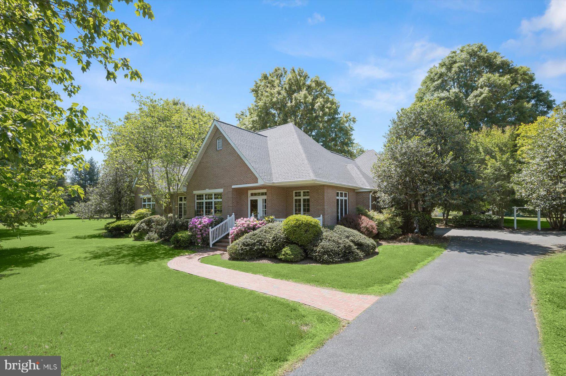 Rare opportunity to own 7.46 private acres in Easton's exclusive Ashby area, with room for horses, a pool, gardens, or future expansion. Offered for the first time in over 30 years—an opportunity defined by setting, privacy, and potential.

A picturesque tree-lined driveway creates a welcoming sense of arrival, leading to a classic French Provincial-style brick residence thoughtfully sited within a serene landscape of mature trees and open space. The setting offers both seclusion and flexibility, with room to reimagine, expand, or simply enjoy the natural surroundings.

This well-maintained home features 3 bedrooms and 2.5 baths, with a comfortable single-level layout ready for its next chapter. Whether updated to reflect modern tastes or preserved and enhanced over time, the property presents a compelling opportunity to create a truly special Eastern Shore retreat.

With acreage, architectural character, and a sought-after location as its foundation, this offering is ideally suited for those seeking space, privacy, and long-term potential in one of Talbot County’s most desirable areas.
Properties like this—held and cared for over decades—are increasingly rare. A unique opportunity to shape your vision in a timeless setting.  Welcome to BLEUHAVEN.
