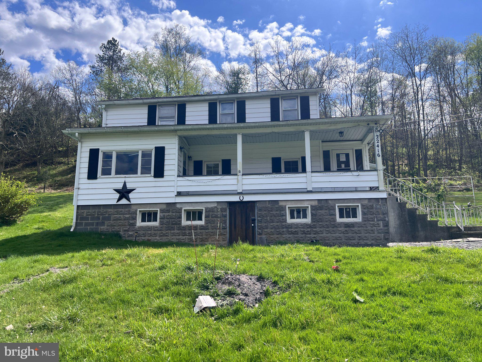REDUCED - Tucked away on a quiet mountain ridge, 22416 Seldom Seen Road lives up to its name—private, peaceful, and surrounded by the kind of natural beauty that’s getting harder to find. This charming 3-bedroom, 1-bath farmhouse offers 1,684 sq ft of warm, comfortable living space on 1.75 acres, creating the perfect retreat for anyone craving space, quiet, and fresh mountain air.

Inside, the home blends classic character with everyday practicality. A bright dining room, spacious living room, and inviting country kitchen form the heart of the home, while the main-level laundry adds convenience. The sunroom/Florida room brings in soft natural light year-round, and the upper-level sitting room offers flexible space for a home office, reading nook, or hobby area.

Outdoors, the property delivers the privacy buyers want—only one visible neighbor, wooded surroundings, and open mountain views that shift beautifully with the seasons. Whether used as a full-time residence, a weekend escape, or a mountain getaway, this home offers a lifestyle defined by quiet mornings, star-filled nights, and room to breathe.

A short drive brings you to Lonaconing for essentials, with easy access to Frostburg, Westernport, and Cumberland for additional shopping, dining, and services. Outdoor recreation—hiking, fishing, hunting, and scenic exploration—is abundant throughout Allegany County.

Sold as-is - repairs needed to heating and plumbing