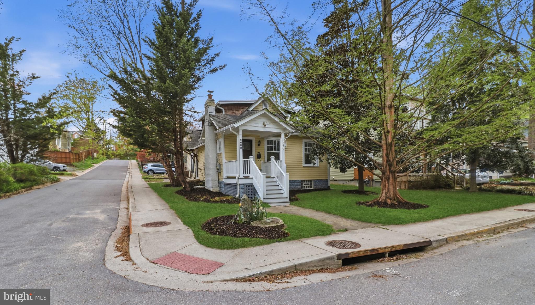 ***Sun 4/12 Open House CANCELLED *** Experience the perfect harmony of 1925 character and sophisticated modern upgrades in this stunning 3-bedroom, 3-bathroom home located in the heart of sought-after Takoma Park. A welcoming porch entry greets you, offering the quintessential neighborhood charm that leads into a bright living room anchored by a classic brick fireplace. The main level flows seamlessly into a formal dining room and a fully updated kitchen equipped with 42-inch cabinetry, granite countertops, and stainless steel appliances. This level also features two comfortable bedrooms and a nicely appointed full bathroom, providing a convenient and flexible layout. An expansive family room with a vaulted ceiling and skylight offers a peaceful retreat with easy access to the private, lushly landscaped backyard. Thoughtfully designed for versatility, this home provides a full bathroom on every level to accommodate a variety of living arrangements. The upper-level primary suite serves as a true sanctuary, complete with a dedicated sitting area, dual closets, and a primary bathroom that was completely renovated this year with a brand-new vanity and fresh tiling on both the floor and the shower. On the lower level, the additional living area has been enhanced with brand-new tile flooring, offering a fresh and functional space for a home office, gym, or recreation room alongside another full bathroom. Modern reliability is built-in with a gas furnace, gas water heater, and a gas range for the home chef. Situated just minutes from the Takoma Metro station, the famous local farmers market, and the vibrant dining and shopping of downtown Takoma Park, this residence offers the ideal blend of suburban tranquility and effortless DC access.