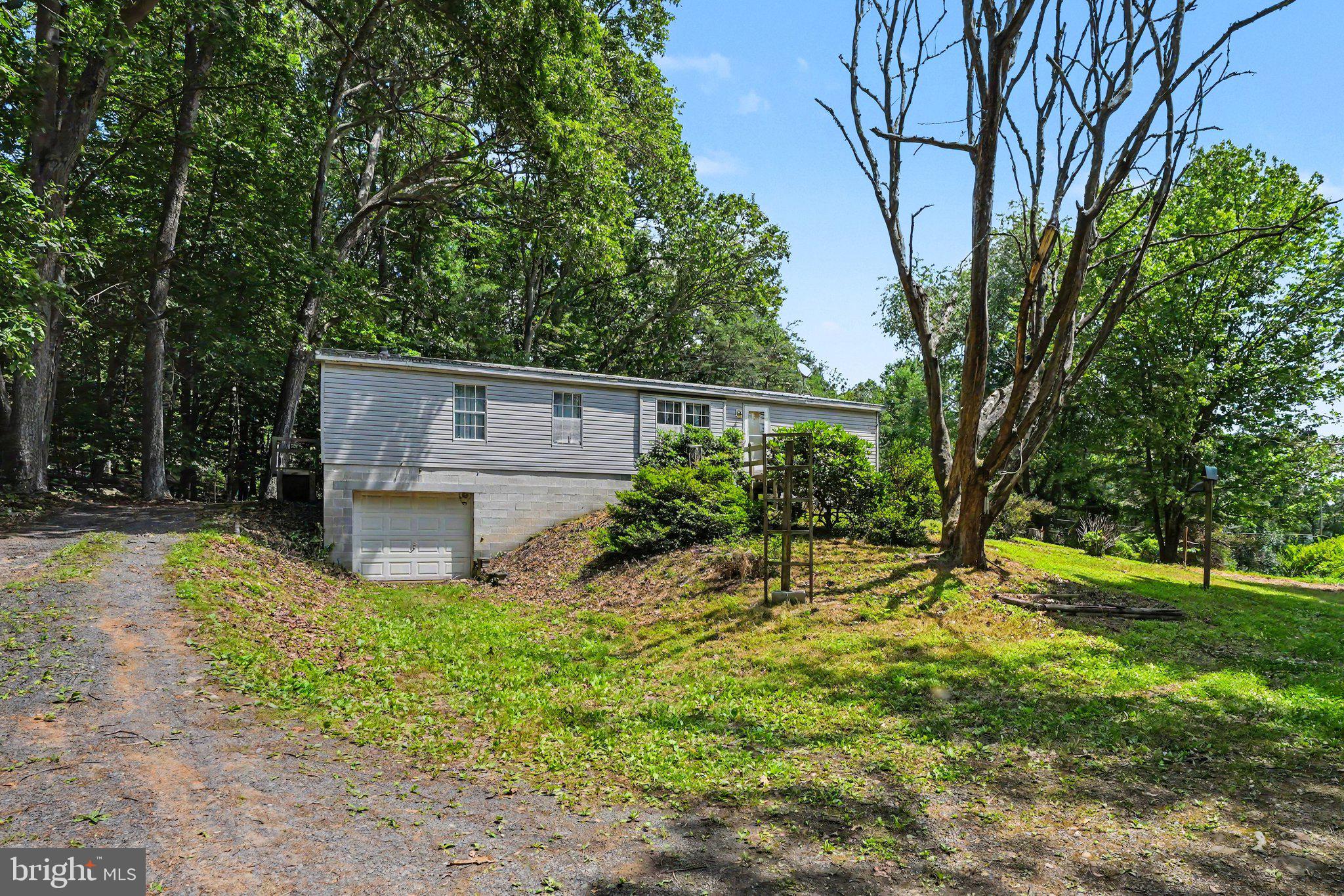 Escape to the peace and beauty of country living with this charming 3-bedroom, 2-bath raised ranch home nestled on over 5 scenic acres in Tuscarora Township. Offering the convenience of one-level living, this home features a spacious open floor plan with an eat-in kitchen that has plenty of storage and includes a separate formal dining area.  It also features handicapped accessibility, main level laundry and a full unfinished basement ready for your personal touch

Recent updates include a new furnace (2021), new soffit (2026), and new carpet in the living and dining rooms, providing added value and peace of mind. The property's beautiful blend of open yard and partially wooded acreage creates the perfect setting for gardening, outdoor recreation, entertaining, or simply relaxing and enjoying nature. Whether you're dreaming of a hobby farm, space for your outdoor toys, or a private retreat to call your own, this property offers endless possibilities, all while being just a short drive from everyday conveniences.
