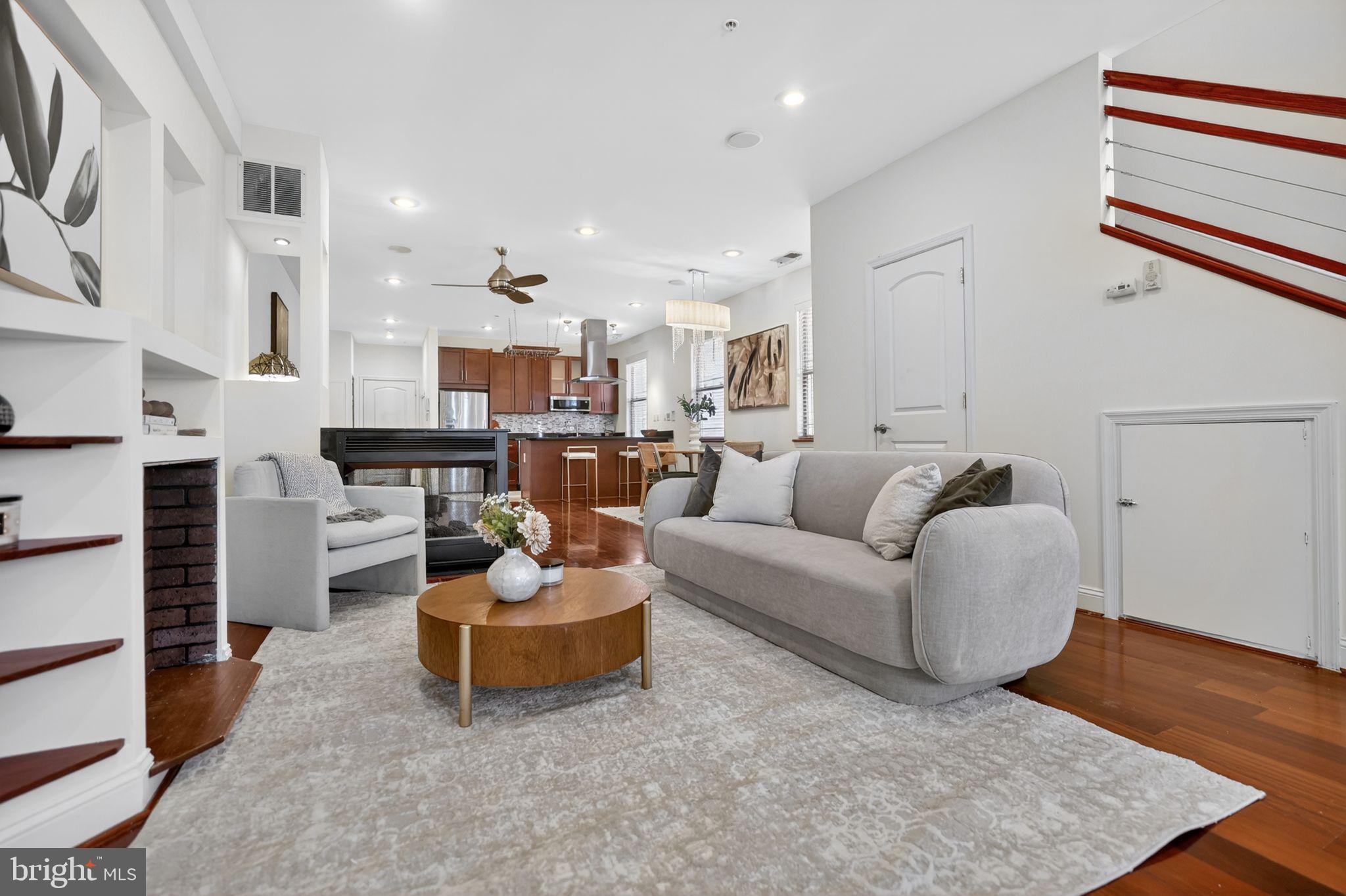 Welcome to this spacious two-level loft-style residence in the heart of Park View. Unit #7 at 3573 Warder St NW offers over 1,400 square feet of thoughtfully designed living space, featuring 2 bedrooms, 2.5 baths, and a flexible layout ideal for modern city living. Brazilian hardwood floors, soaring ceilings, and oversized windows create a bright, airy atmosphere throughout the home.

The open-concept main level is perfect for entertaining, complete with granite countertops, cherry cabinetry, stainless steel appliances, recessed lighting, and a cozy fireplace. Just off the living area, enjoy one of two semi-private balconies — a perfect spot for morning coffee or evening relaxation. A second semi-private balcony extends from the primary bedroom, offering additional outdoor space rarely found in condo living.

Upstairs, both bedrooms provide comfort and privacy, along with a versatile den/office space between them — ideal for working from home, a reading nook, or additional flex space. The primary suite features a spa-inspired bath with a Jacuzzi soaking tub and generous closet space.

This home also stands out for its exceptional storage options, including added storage in the primary bedroom, under the staircase, and in the hallway — unique enhancements not found in comparable units within the building. Additional conveniences include gated parking and a boutique 8-unit building atmosphere.

Located moments from neighborhood dining, cafés, and parks, with easy access to the Georgia Ave–Petworth Metro Station and the vibrant retail and restaurants of Columbia Heights, this home blends space, style, and unbeatable urban convenience.

Please note: Square footage is estimated and calculated by an independent third party; information is deemed accurate but not guaranteed.