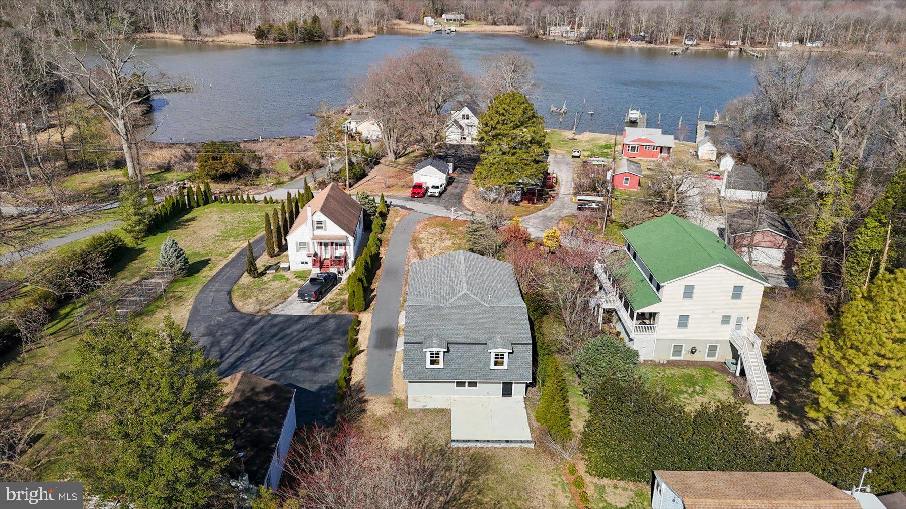 ***LARGE PRICE REDUCTION***Welcome to beautiful 2507 Island View Road. Discover the pinnacle of coastal-inspired living in this stunning, custom-built Modern Farmhouse. This incredible home features 4 spacious bedrooms and 3 full bathrooms, located in the exclusive water-oriented community of Barrison Point.  Expertly crafted with unparalleled attention to detail, this light-filled sanctuary features an open-concept layout anchored by a gourmet kitchen with custom cabinetry, quartz countertops, and an oversized entertainer's island. High-end finishes abound, including gleaming hardwoods, Pella windows and sliding door, and solid core maple and cherry interior doors. Rock Wool insulation and high-efficiency split HVAC units in every room ensure maximum comfort and energy efficiency.  The versatile floor plan boasts those four bedrooms, including two private en-suites, and a separate entrance perfect for an in-law suite, au pair quarters, or a secluded home office.  Situated on a private .23-acre lot just steps from the water, you are walking distance to Rocky Point State Park, public boat ramps, and local golf courses. Experience a rare sense of tranquility in this private retreat, where the stillness of your secluded surroundings is perfectly balanced by easy access to nearby marinas, hiking trails, and local waterfront favorites.