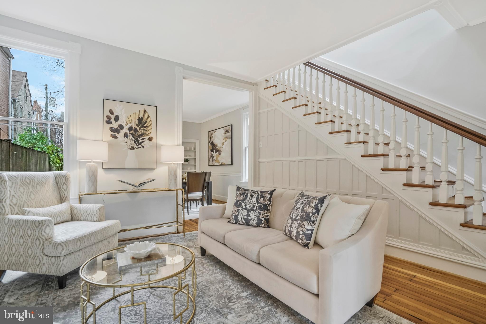 Welcome to this stunning brick end unit townhouse right in the heart of historic Old Town! Enter the residence to find an abundance of natural sunlight highlighting the gorgeous wood floors and 10 ft ceilings throughout the spacious dining and living areas. The completely updated kitchen, including the never-been-used appliances, overlooks the intimate private backyard with convenient side walkway access. There is a half bath tucked away on the main level. Enjoy the heated tile floors in both the kitchen and upper-level primary suite bathroom, which features restored clawfoot tub. Experience tranquility in the primary suite bedroom with its vaulted ceiling and box bay window overlooking the lovely backyard brick patio. The gorgeous wood floors continue throughout the upper level. The second exceptionally large bedroom accommodates robust closets for all your storage needs. The third bedroom sits beside the completely remodeled full hall bathroom. The home is upgraded with a dual-zone HVAC system for added control and comfort.  A brand new washer and dryer are found in the basement, which was waterproofed in 2023. Get excited for the beautiful transformation of this 1890 townhouse with over $260k in updates. Located right across from the Armory Tot Lot and just a block away from King Street and all that Old Town has to offer. Windows convey as-is. Check out the 3D tour! We request that offers, if any, to be submitted by 10pm on Saturday and will be reviewed Sunday morning.