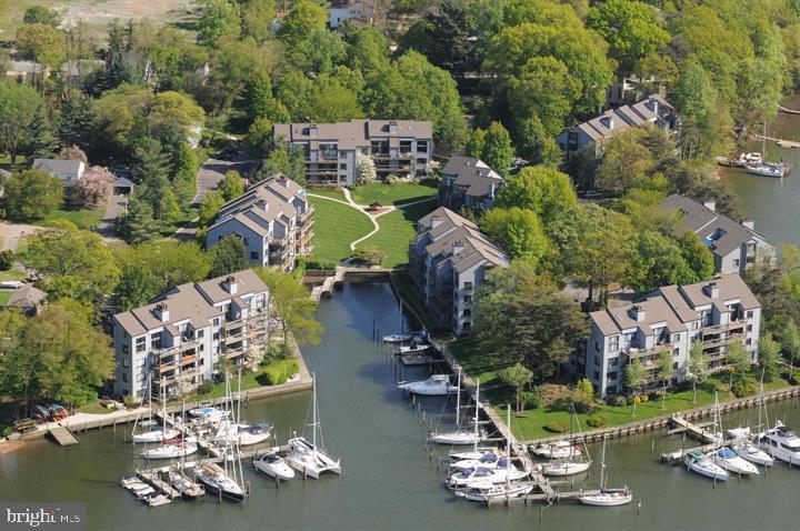 OPEN SATURDAY 6/6 _ 12-2  Come enjoy the ease of single-level living, secure community, and the unmatched lifestyle of waterfront. The warm and inviting living room opens to sweeping Spa Creek Views, while a dazzling kitchen with a picturesque window makes creating a meal a delight...with a wood-buring fireplace and engineered hardwoods. Step outside through sliding doors to a relaxing deck enjoying the sunsets. Extra storage on the deck and in the basement for all your needs. There are boat slips available, depending on size and water depth. Shearwater is one of Annapolis's most coveted gated communities know for its lush landscaping, amenities, and easy access to downtown. Here, you enjoy the best of both worlds-resort-style living while being minutes away from restaurants, shops, and the charm of Historic Annapolis. Enjoy an abundance of nature, blue herons, osprey, and wild fowl. The Shearwater community offers a private waterfront pool with sun deck, pickleball, regulation racketball court, tennis, kayak and dinghy rack/storage, a deep water marina, walking paths-all within a gated community. Enjoy a nice walk, bike, ride, or the water taxi will pick you up at the marina dock and take you downtown. All the fun activities in Eastport are right at your back yard. The Eastport Yacht Club parade of lights in December makes it's final turn right in front of  Shearwater. Rare opportunity to combine waterfront access and the timeless Annapolis Lifestyle.