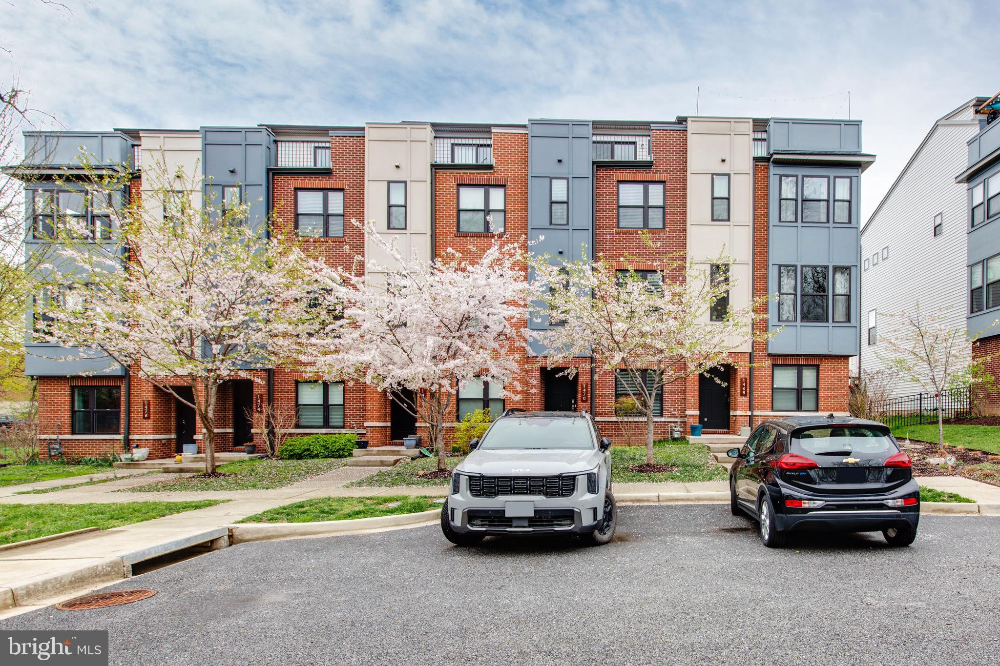 Welcome to 1470 Redfern Ave! This stunning brick-front 4-level townhome with a one-car garage is nestled in the highly sought-after Hampden community, offering the perfect blend of city convenience and modern living. Featuring 4 bedrooms and 3.5 baths, this home is filled with natural light from the moment you walk in. The entry-level offers a private bedroom and full bath—ideal for guests or a home office—with convenient access to the garage. The main level boasts an open floor plan with high ceilings, beautiful hardwood flooring, and a gourmet kitchen complete with a large island, stainless steel appliances, and ample cabinetry for storage.  The third-floor primary suite is a true retreat, featuring a spacious walk-in closet and a spa-like bath with dual vanities and a glass-enclosed shower. Two additional bedrooms, a full bath, and a laundry room complete this level. Step outside to enjoy multiple decks, including a rooftop terrace with a wet bar—the perfect space for entertaining or relaxing while taking in the views of lush trees and greenery. Located in a vibrant community with top-rated schools nearby, this home combines luxury, comfort, and location—all in one.