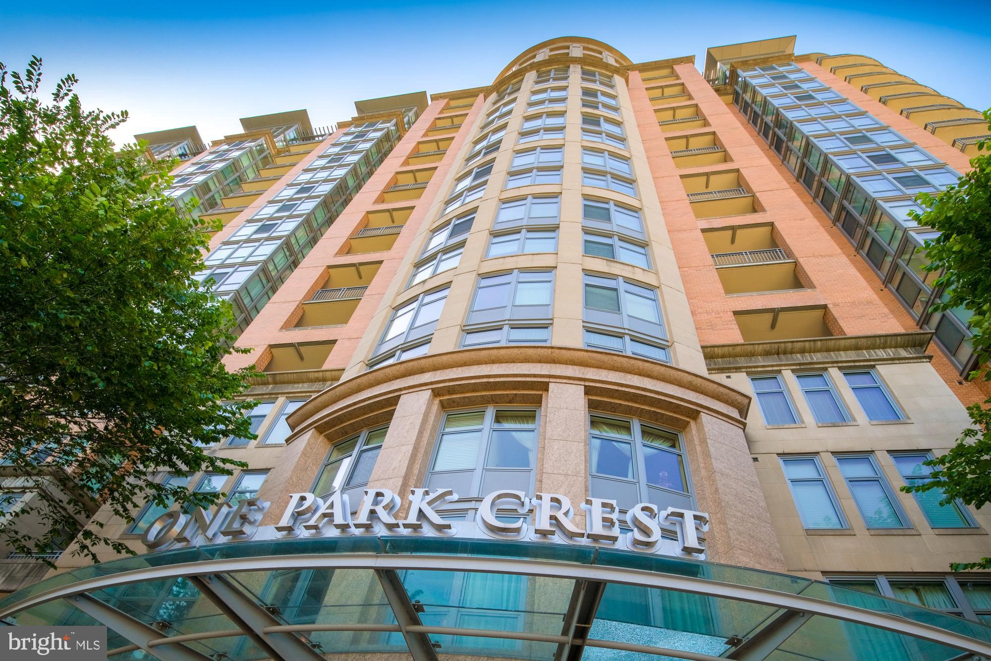 Nestled within the prestigious ONE PARK CREST CONDOMINIUM, this exquisite 2-bedroom, 2-bathroom residence offers a harmonious blend of contemporary elegance and modern convenience. Built in 2008, this high-rise unit boasts a sophisticated architectural style, characterized by its sleek brick exterior and thoughtfully designed interiors. Step inside to discover a spacious open-concept layout that seamlessly integrates the dining and living areas, creating an inviting atmosphere perfect for both relaxation and entertaining. The gourmet kitchen is a culinary enthusiast's dream, featuring high-end stainless steel appliances, including a gas range, built-in microwave, and dishwasher. The elegant cabinetry and ample counter space provide both functionality and style, making meal preparation a delight. Retreat to the generously sized bedrooms, each designed to be a personal sanctuary. The master suite offers a serene escape, complete with an en-suite bathroom that exudes luxury. Both bathrooms are well-appointed, showcasing modern fixtures and finishes that elevate everyday routines into indulgent experiences. This unit is equipped with convenient in-unit laundry facilities, featuring front-loading washer and dryer, ensuring that daily chores are handled with ease. The property also includes secure parking in a basement garage, providing peace of mind and convenience. The community amenities are truly exceptional, offering a lifestyle of leisure and luxury. Enjoy access to a stunning rooftop pool, perfect for soaking up the sun or hosting gatherings with friends. The clubhouse and party room provide additional spaces for socializing, while the exercise room and library cater to both fitness enthusiasts and those seeking a quiet retreat. Safety and security are paramount, with 24-hour security, a monitored system, and a welcoming lobby desk ensuring residents feel at ease. The meticulously maintained grounds, complete with exterior lighting and street lights, enhance the overall ambiance of this vibrant community. Located just a short distance from public transportation options, this residence offers both convenience and accessibility. Experience the ultimate in luxury living at ONE PARK CREST, where every detail has been thoughtfully curated to provide an exclusive lifestyle that feels like home.